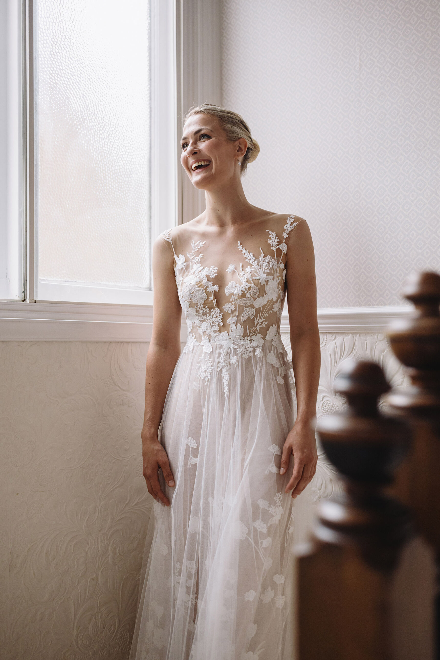 Bride wearing Anna Kara wedding dress with climbing floral lace. Image by Wolf & Co. Photography.