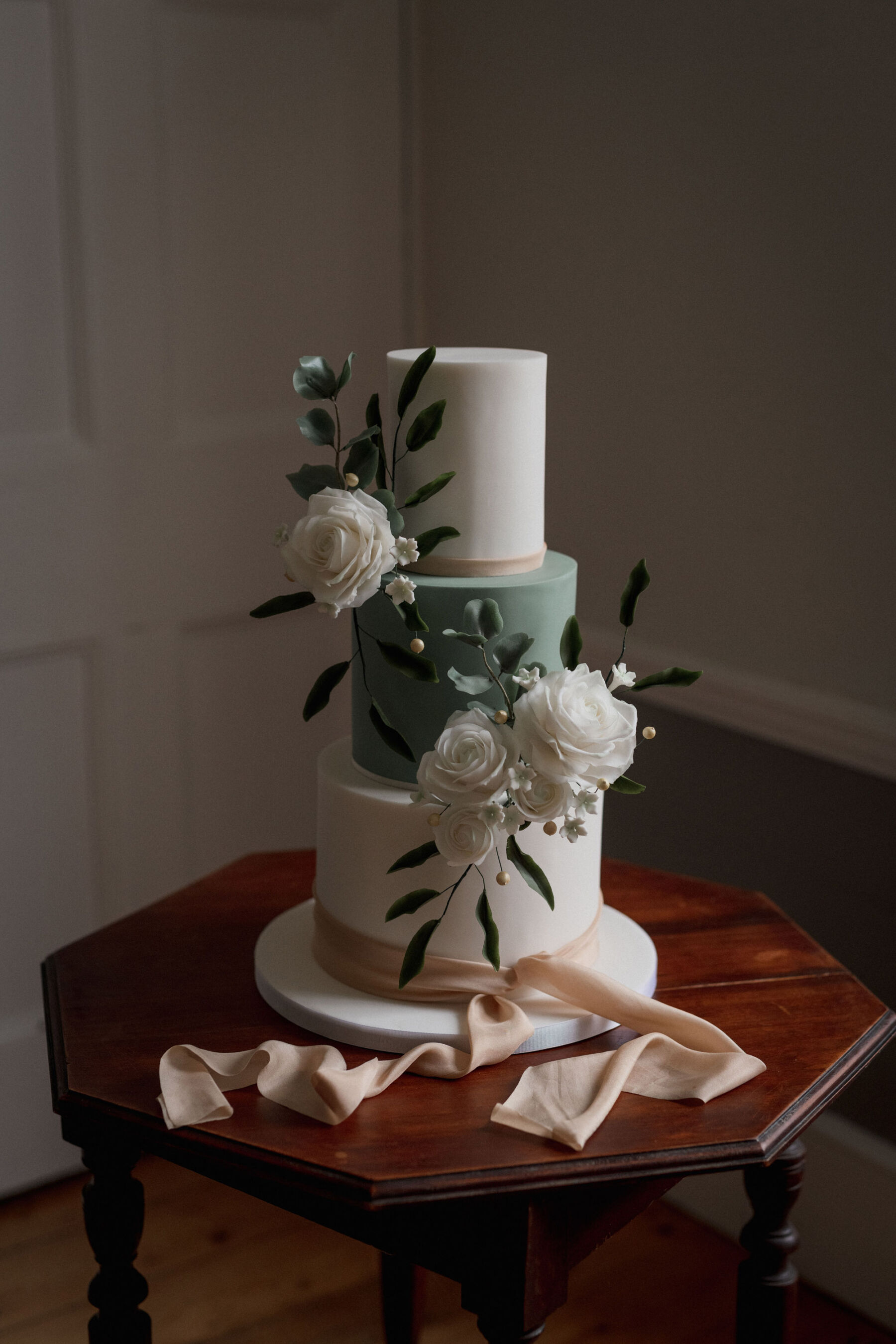 3 tier green & white wedding cake. Lyra & Moth Photography.