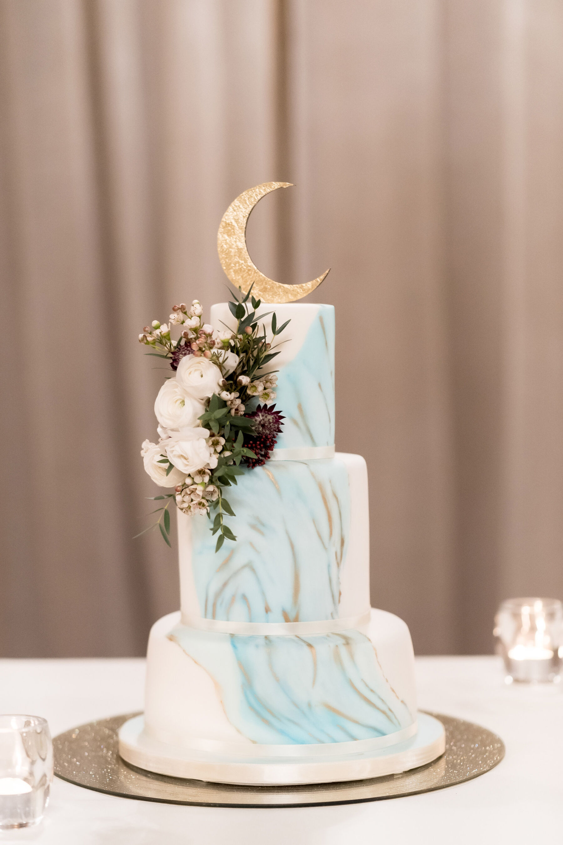 Celestial wedding cake with crescent moon cake topper.