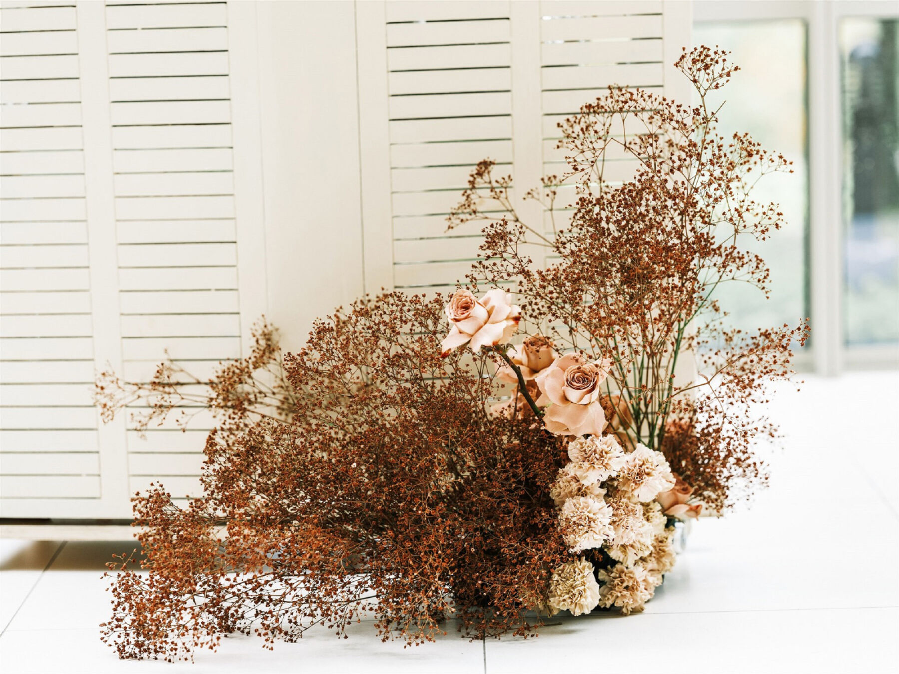 Modern Autumn wedding flowers display for wedding ceremony aisle