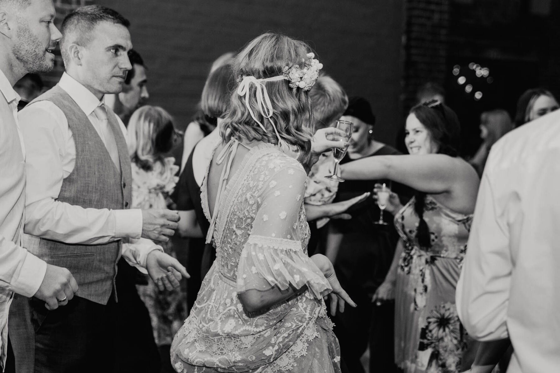 Bride wearing Needle and Thread wedding dress on the dance floor.