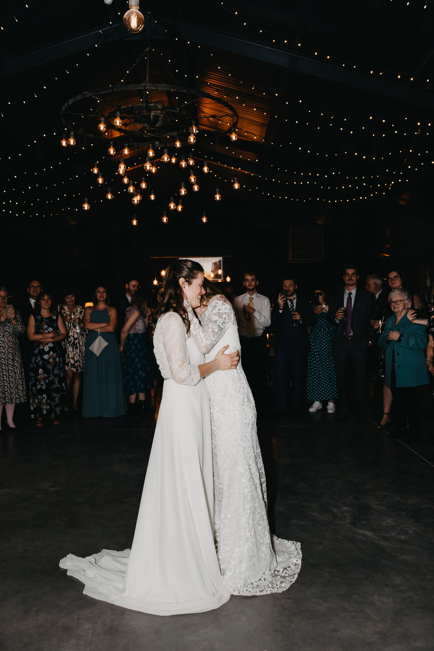 Two brides at LGBTQ+ wedding on the dancefloor. Jessica Grace Photography.