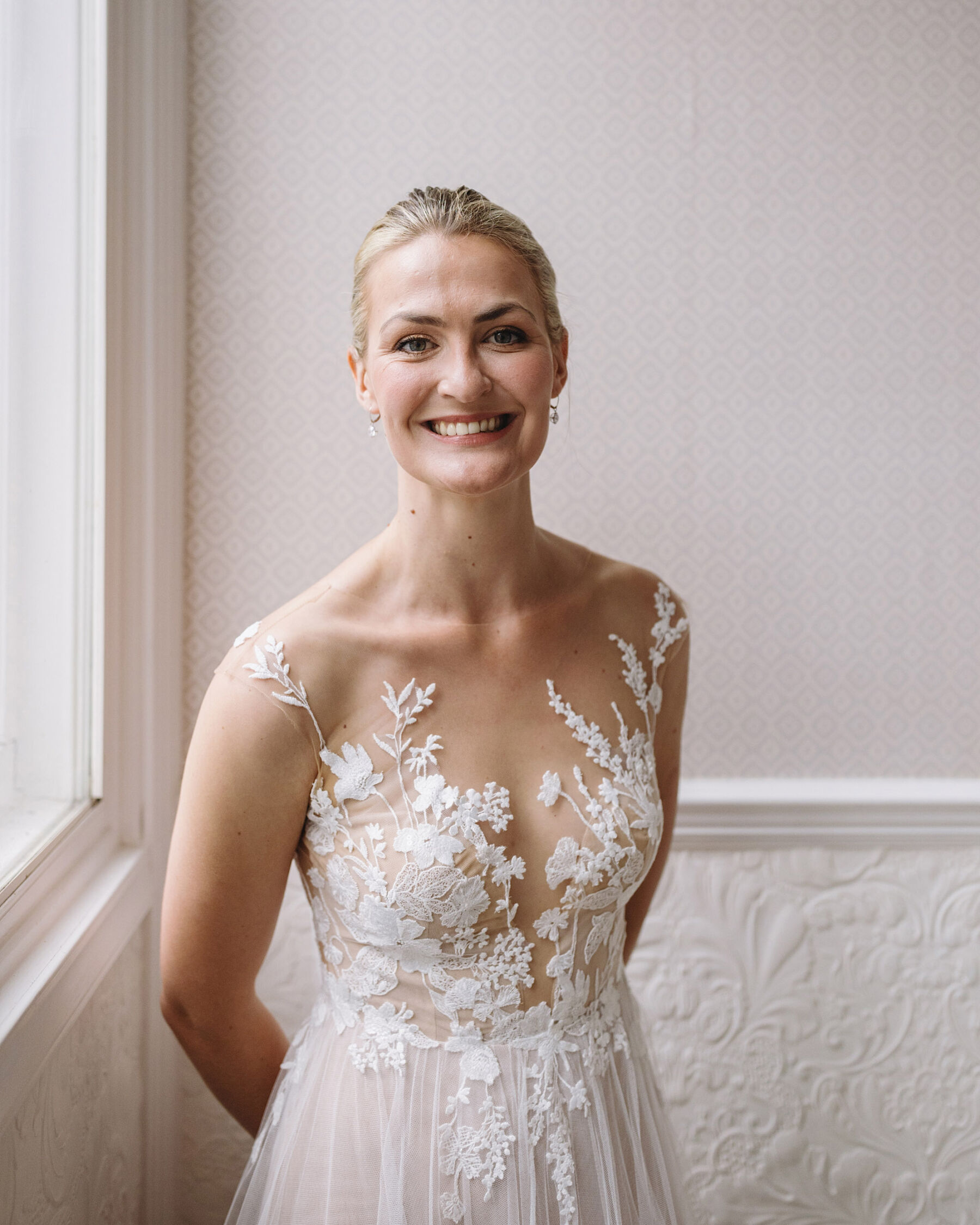 Anna Kara bride with floral lace motifs. Wolf & Co. Photography.