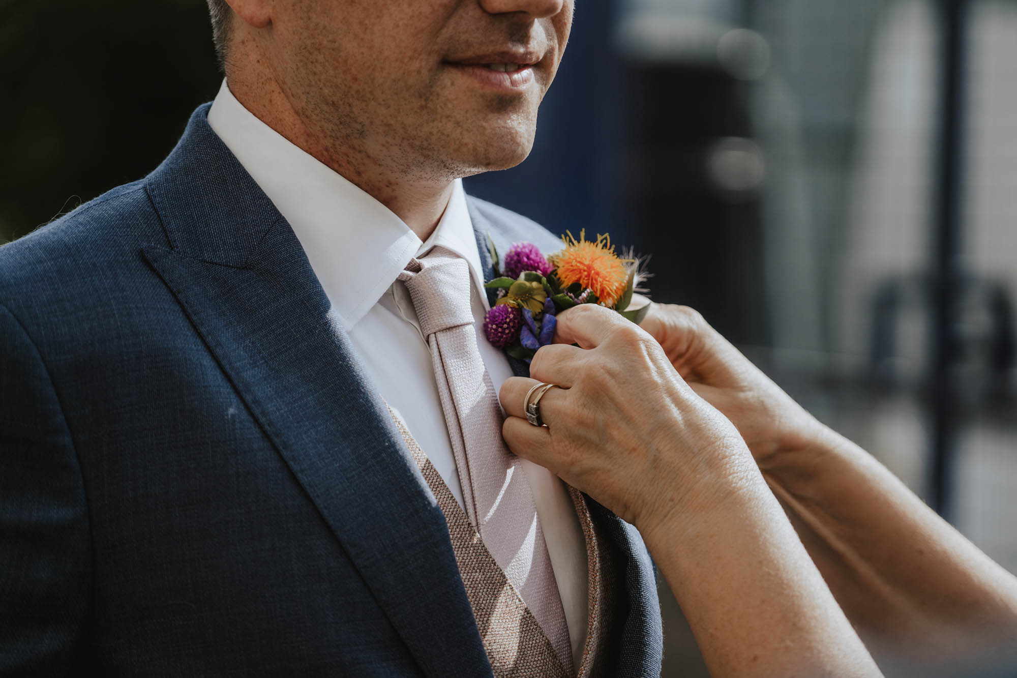 Groom colourful buttonhole