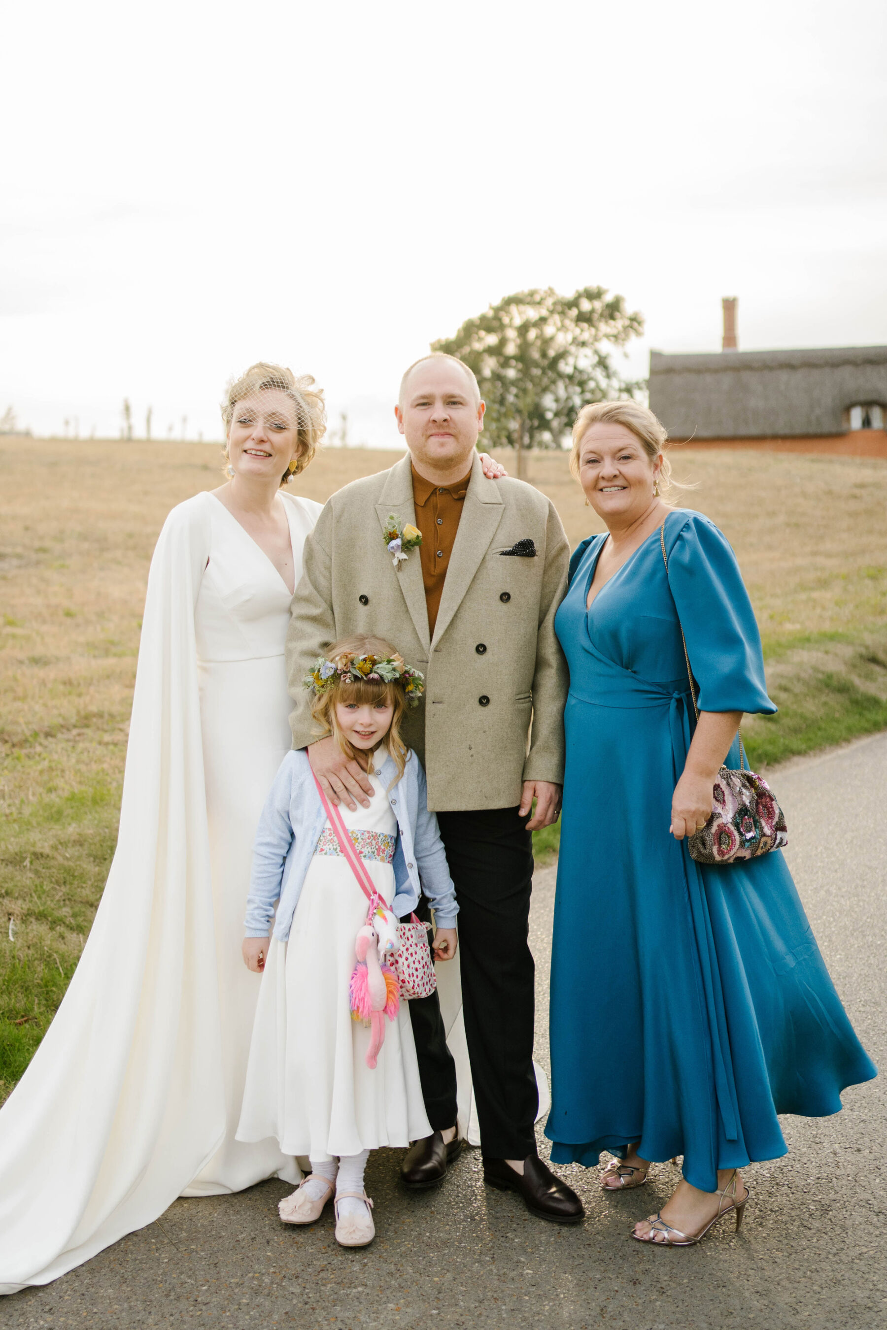 Andrea Hawkes wedding - bride in sleeve capes wedding dress