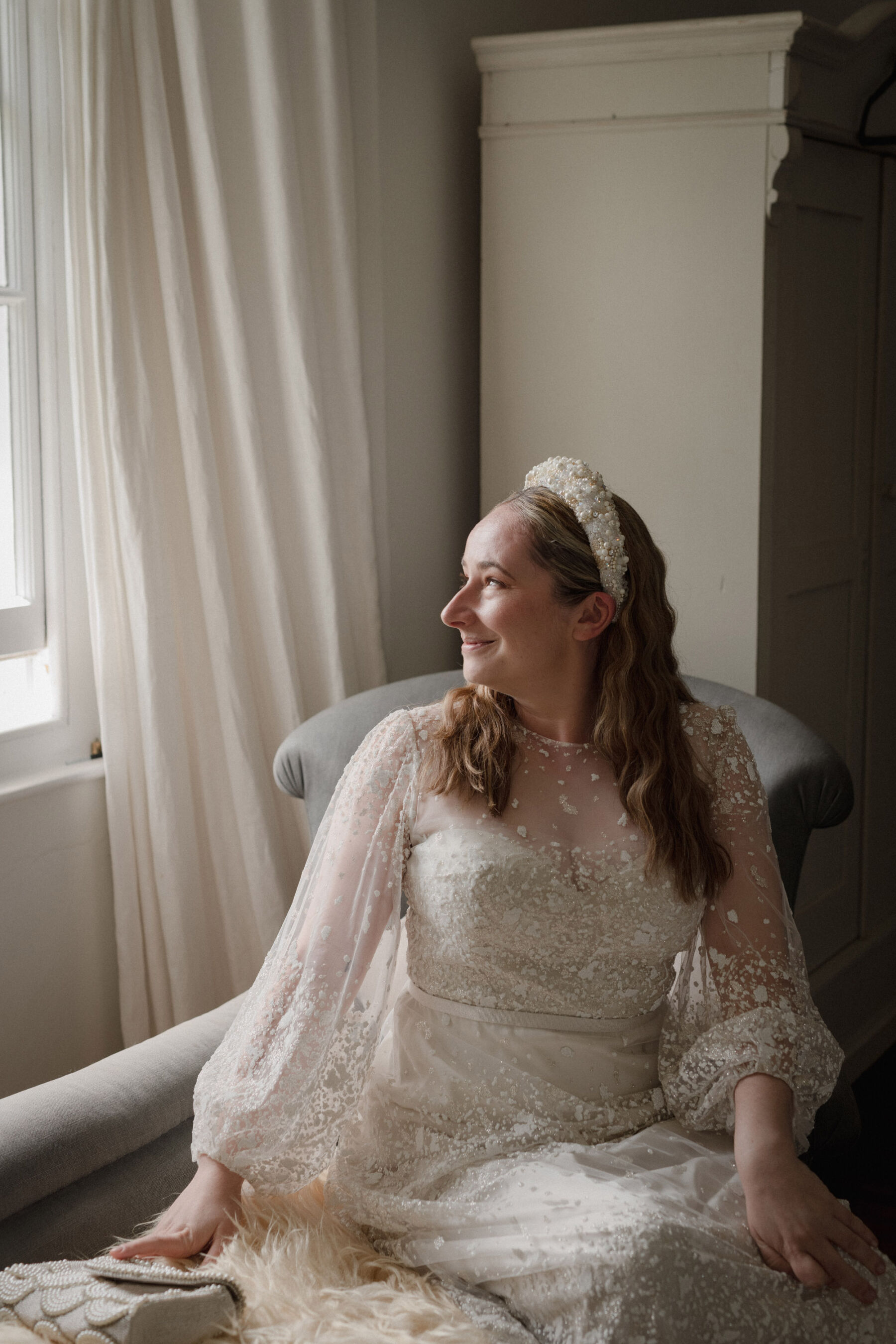 Bride wearing Jesus Peiro wedding dress + pearl headband. Lyra & Moth Photography.