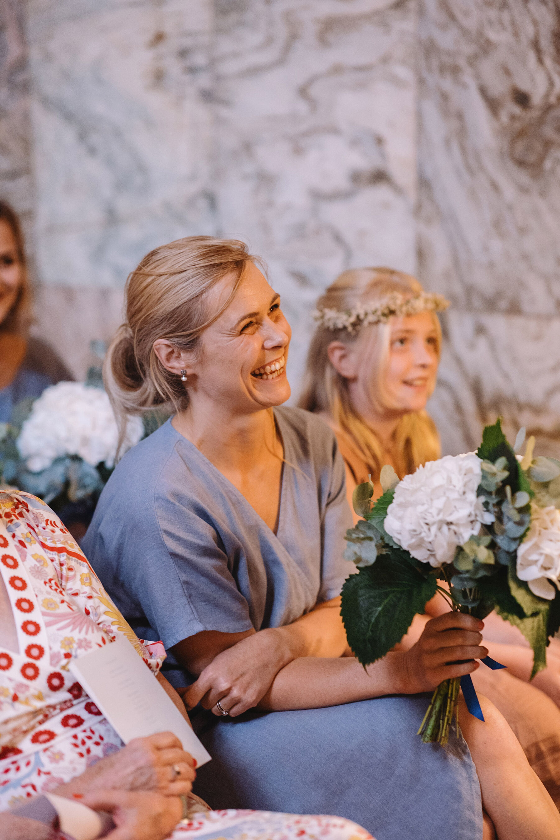 Bridesmaids in pale blue linen dresses. Wolf & Co. Photography.