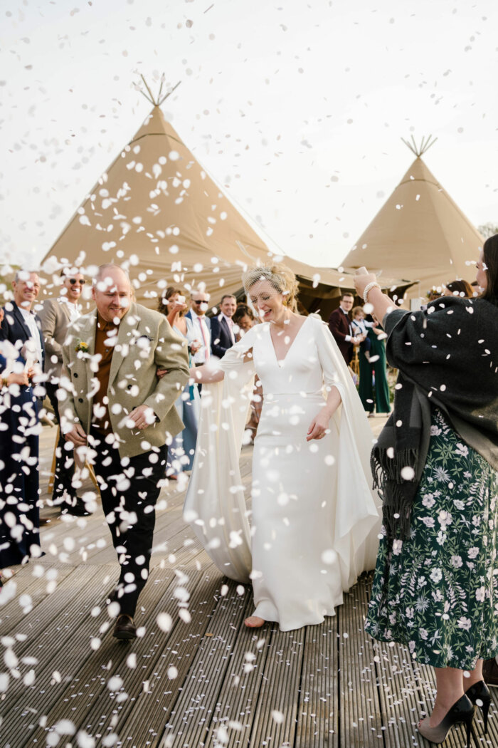 Confetti shot next to wedding tipis. Designer Andrea Hawkes wedding at Wilderness