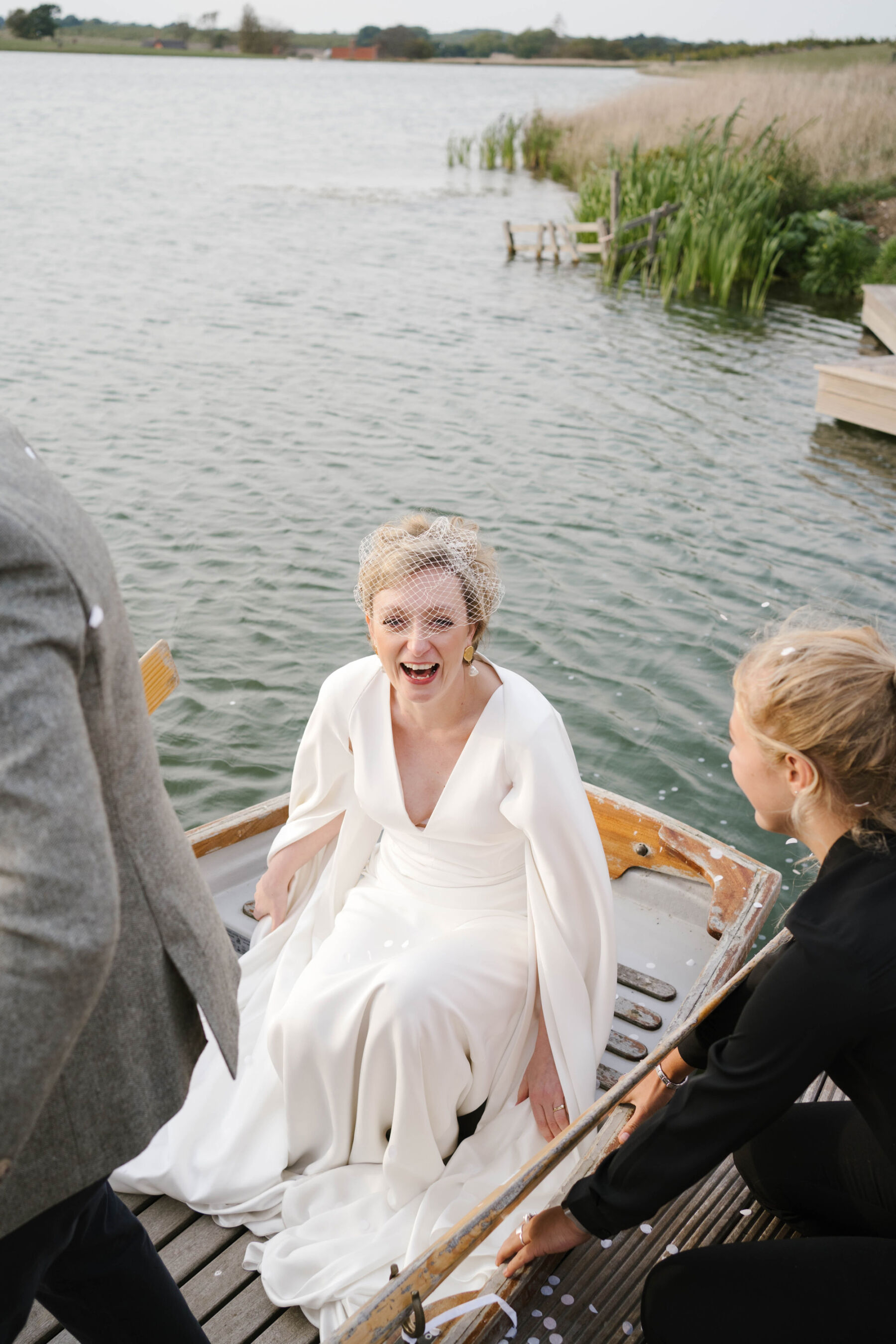 Andrea Hawkes bride in a boat at Wilderness Reserve Suffolk wedding venue