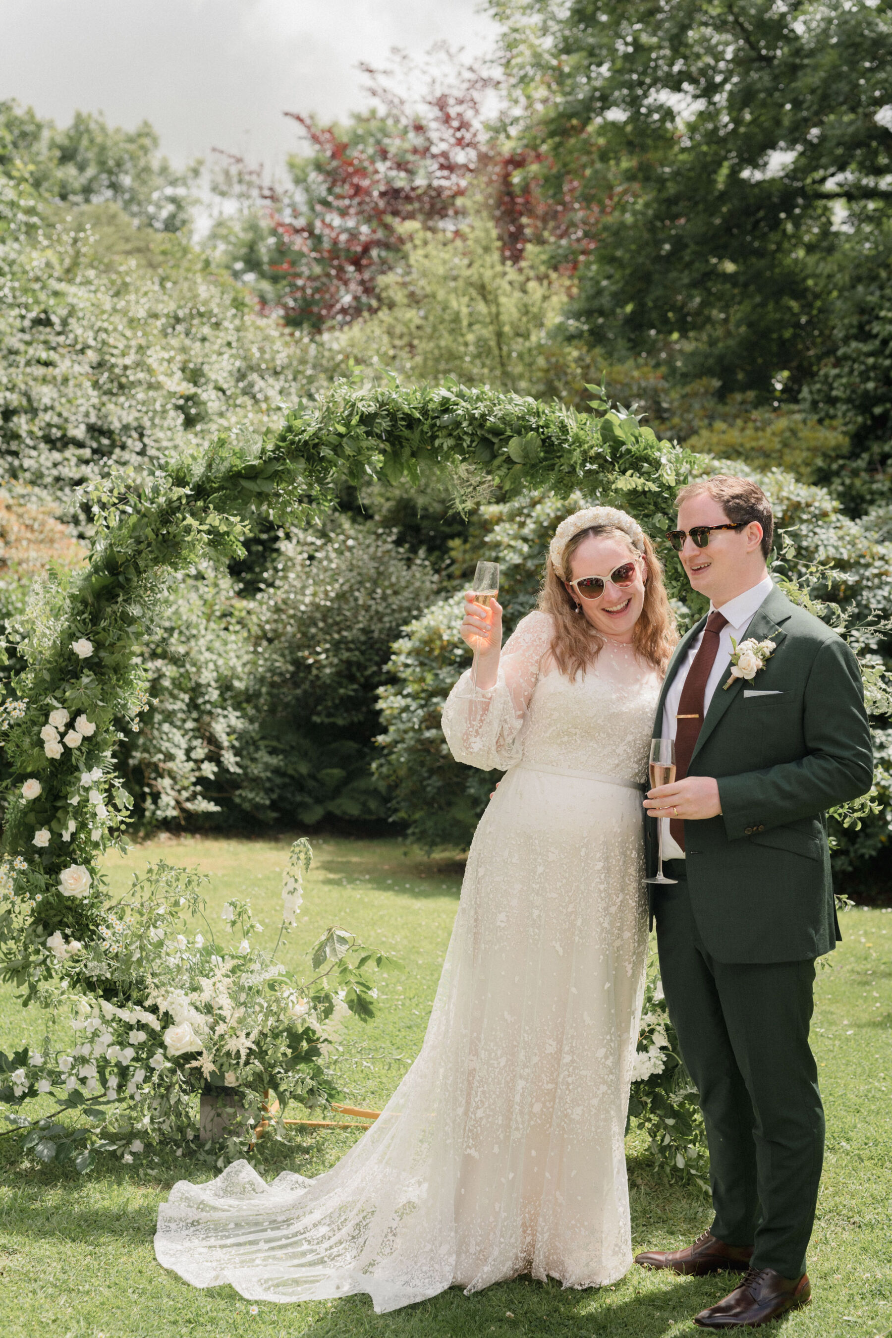 Happy bride in sunglasses & Jesus Peiro wedding dress. Lyra & Moth Photography.