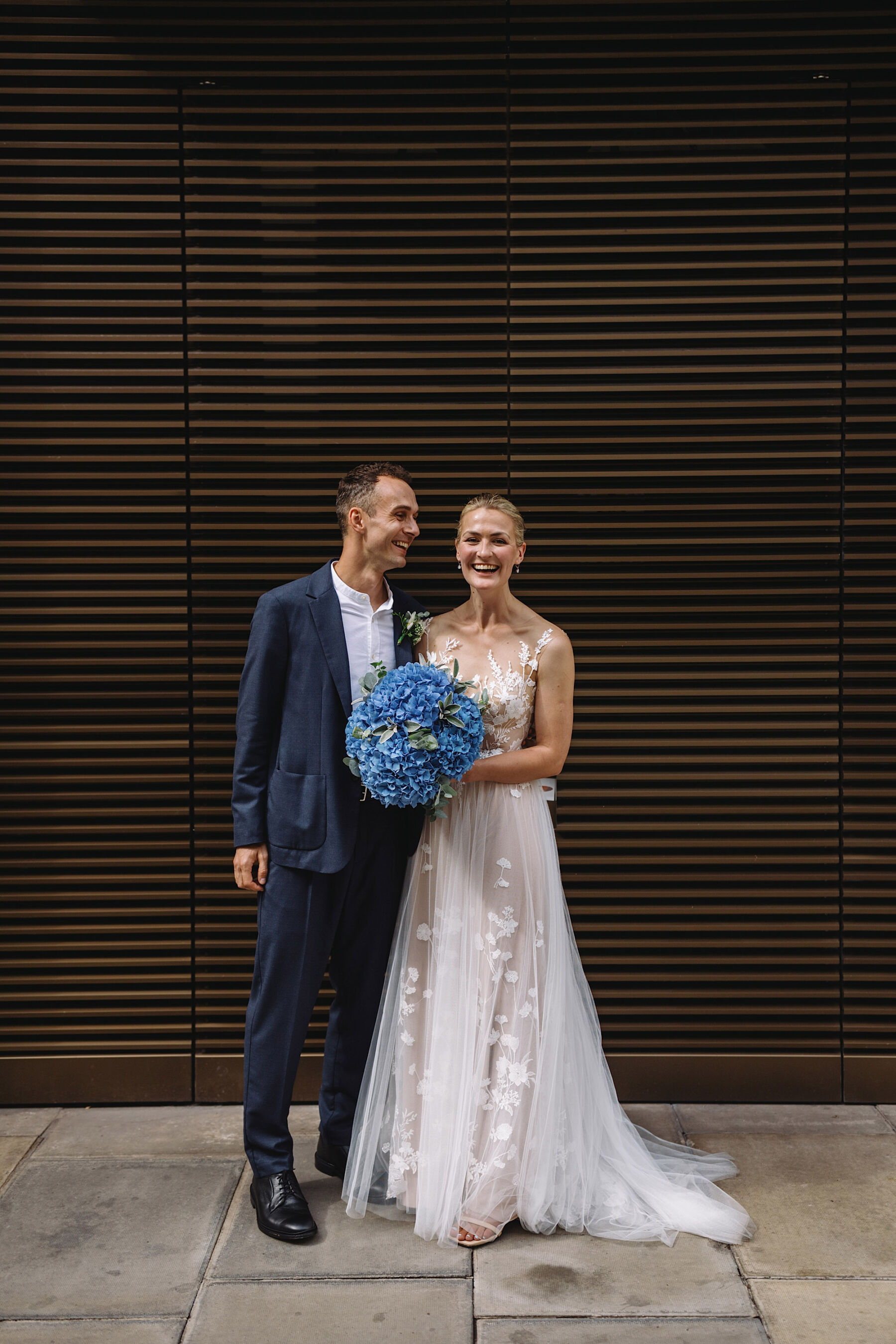 Anna Kara bride with large blue hydrangea bouquet.