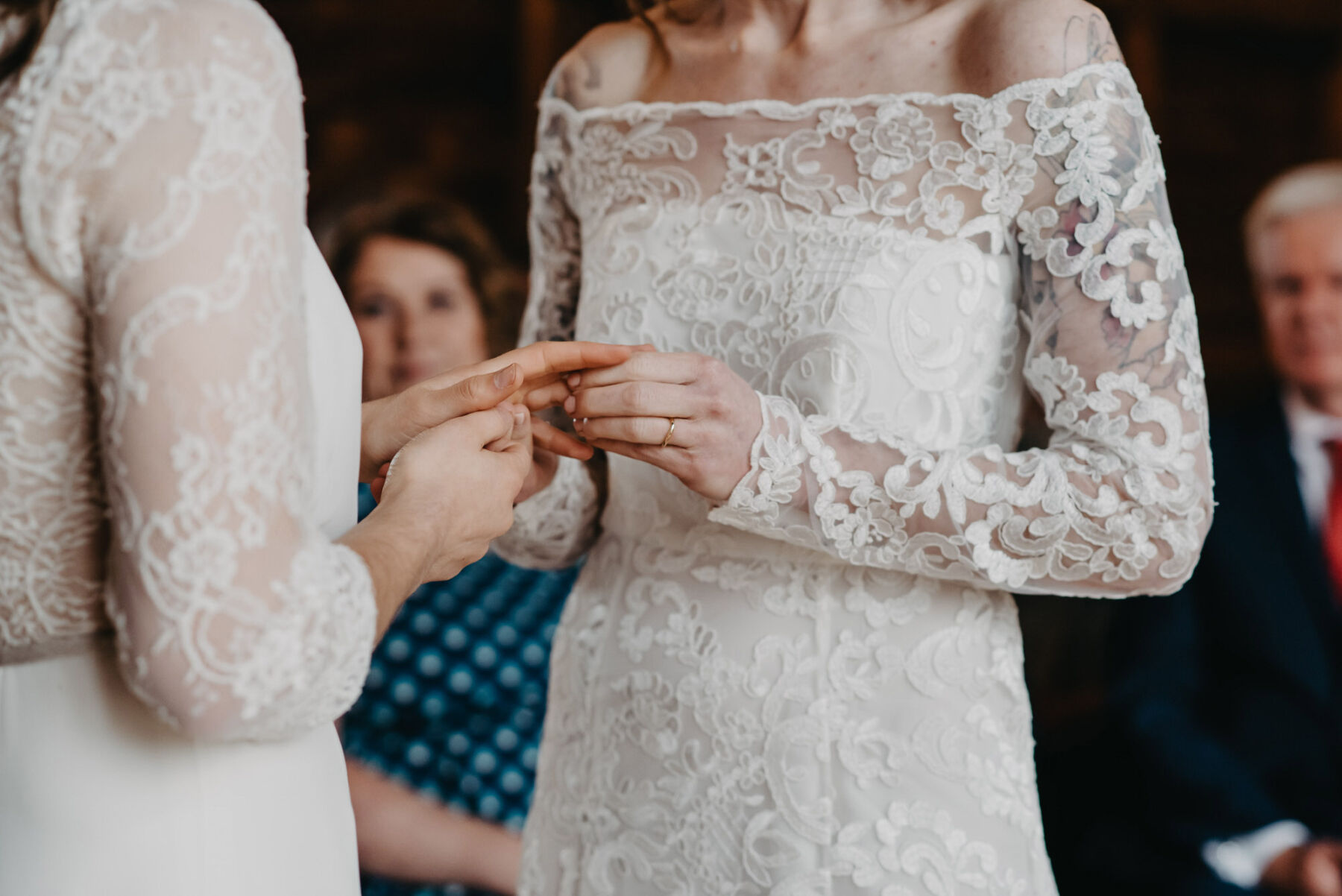 LGBTQ+ wedding - two brides exchanging rings during wedding ceremony. Jessica Grace Photography.