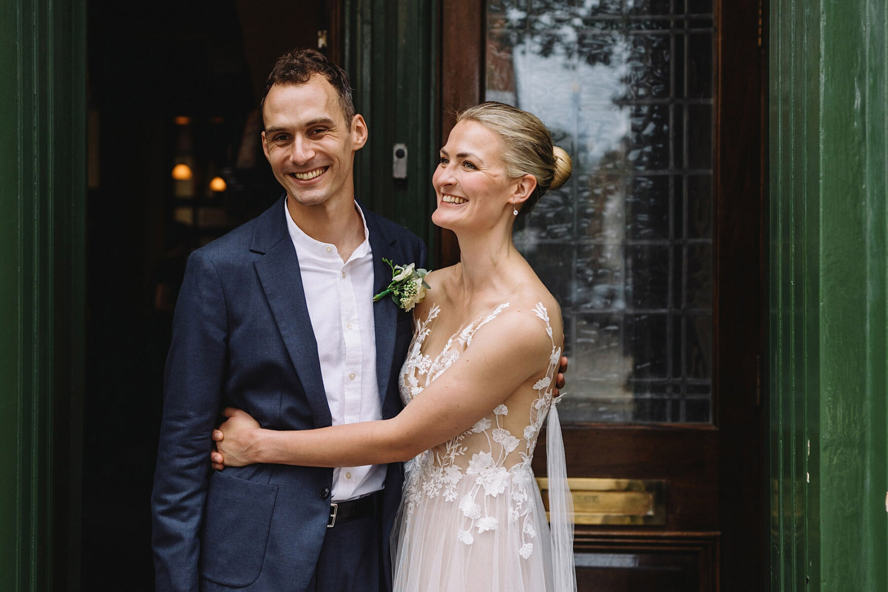 Anna Kara bride in London. Groom in informal blue suit.