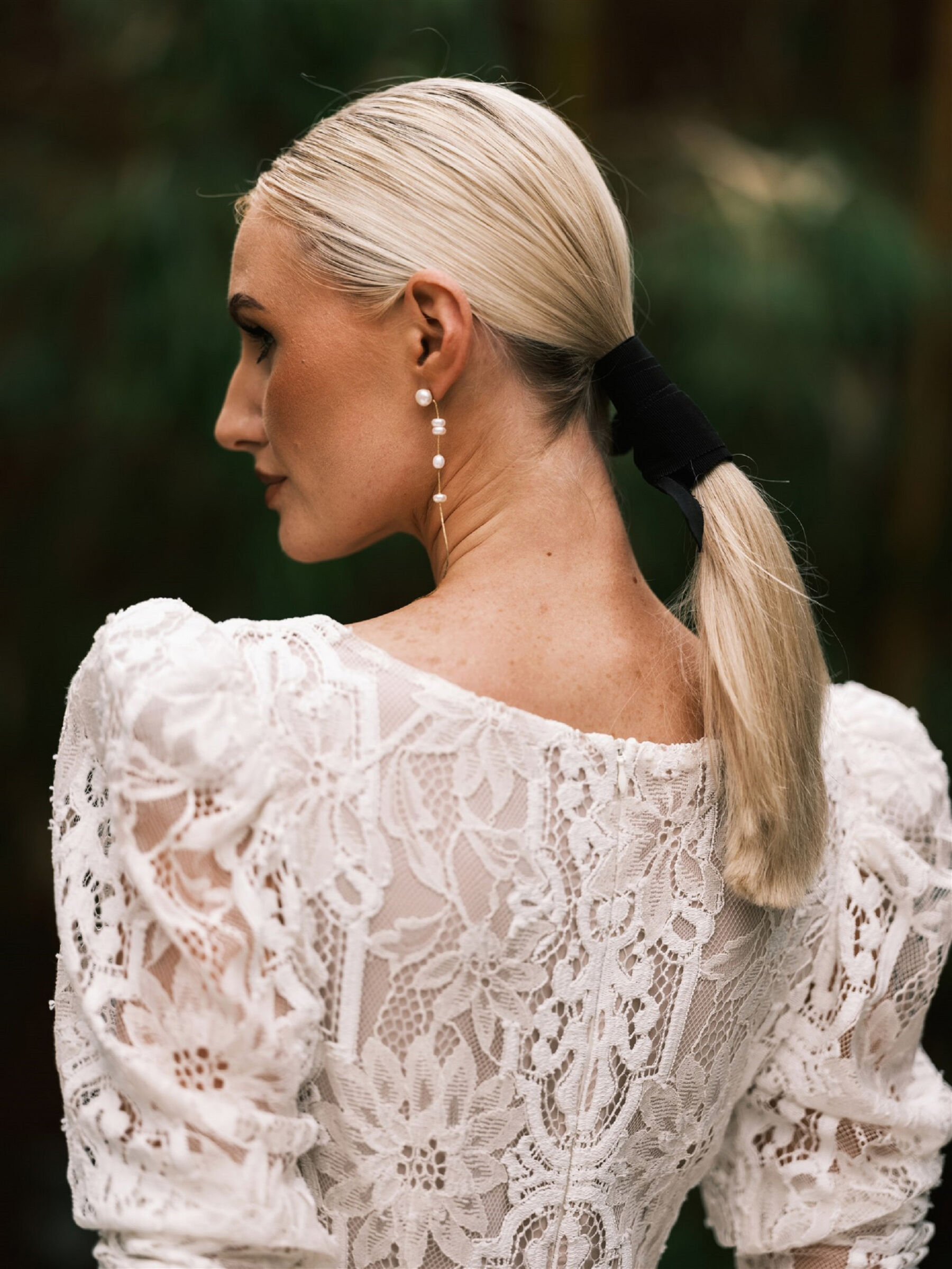 Katya Katya London lace wedding dress. Bridal ponytail.