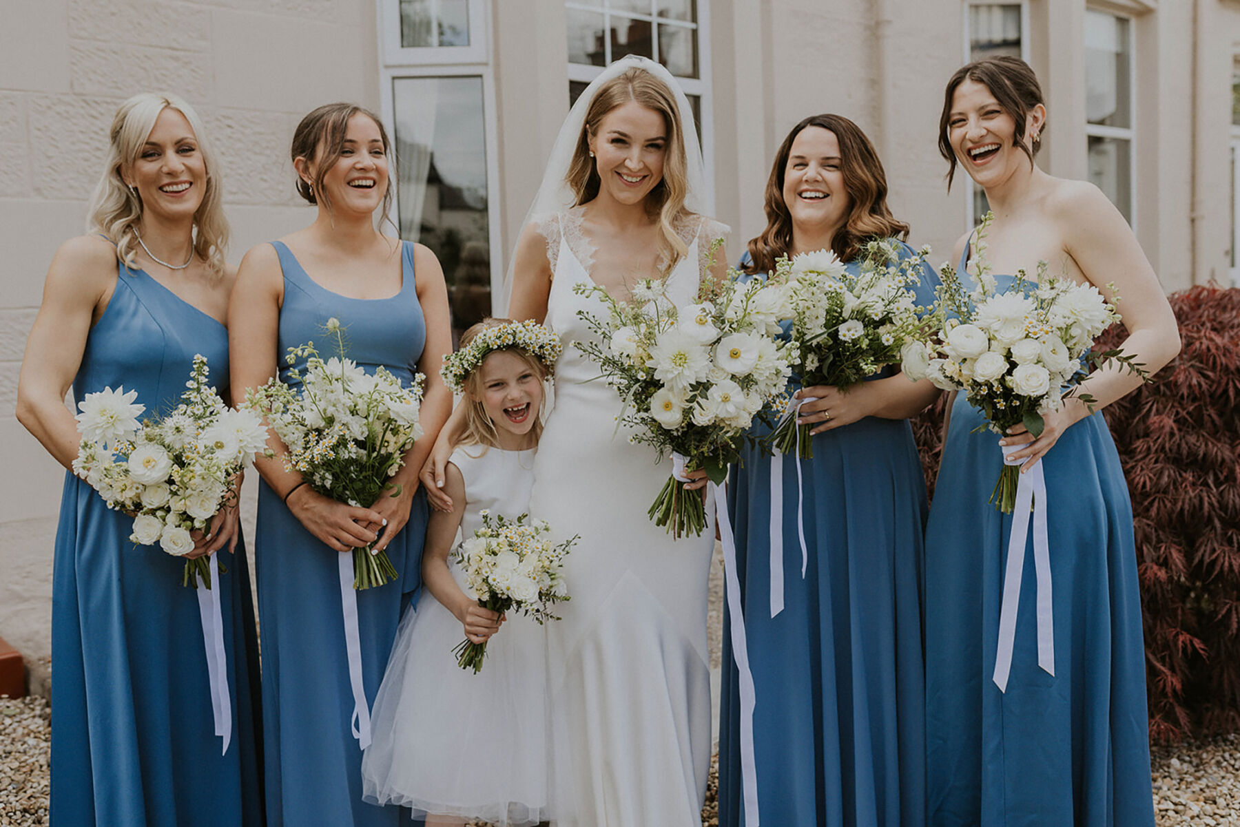Bridesmaids in Cornflower blue + white bouquets