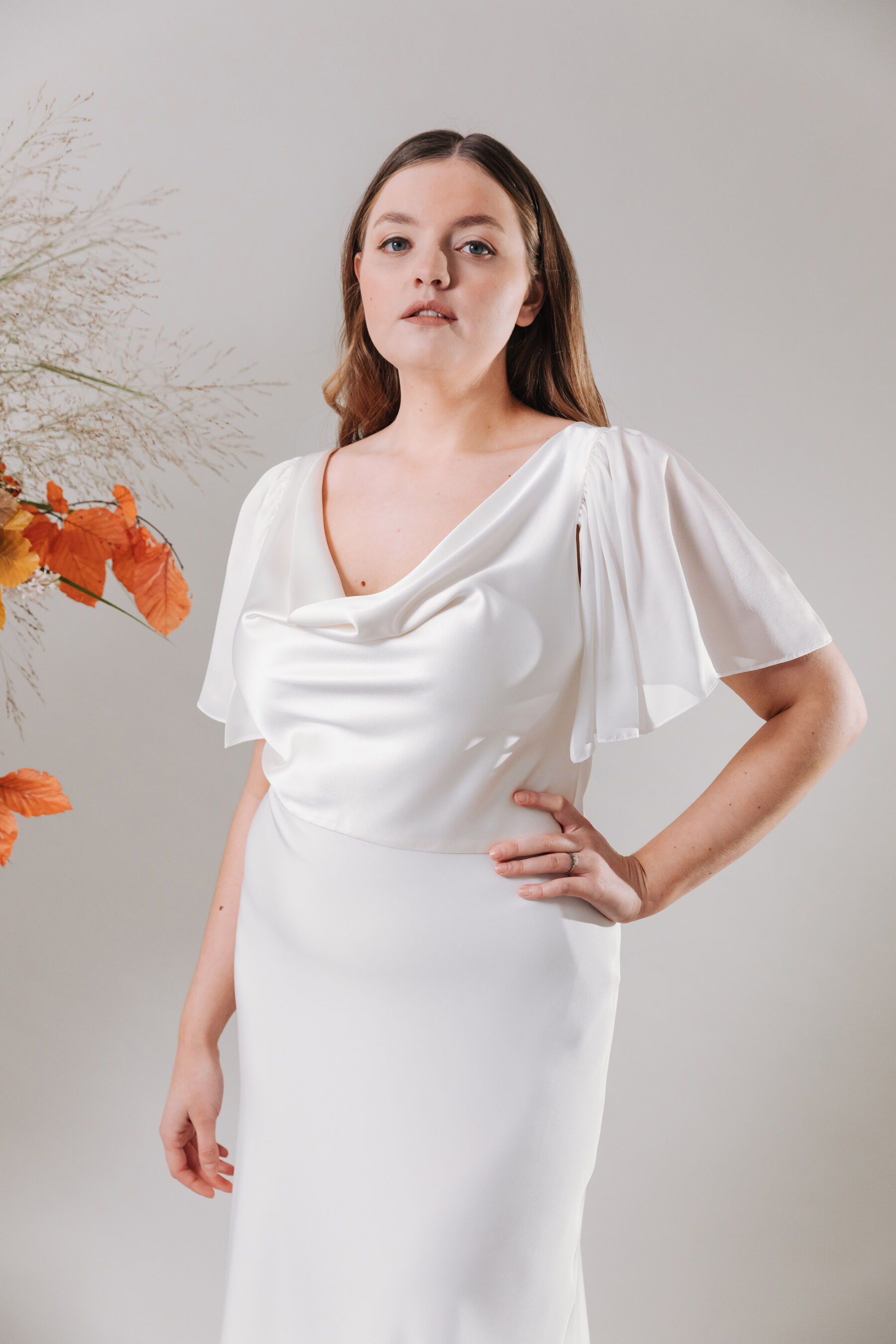 Cowel neck wedding dress for a curvy bride by Kate Beaumont.