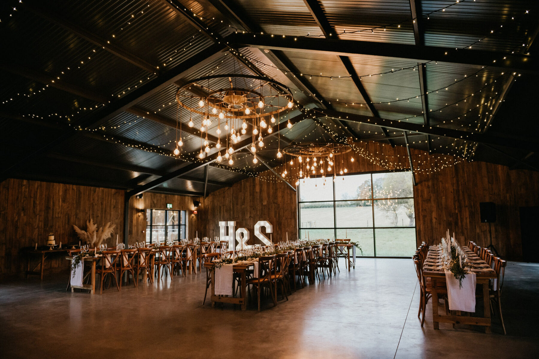 Silchester Farm - Hampshire barn wedding venue with hanging lights. Jessica Grace Photography.