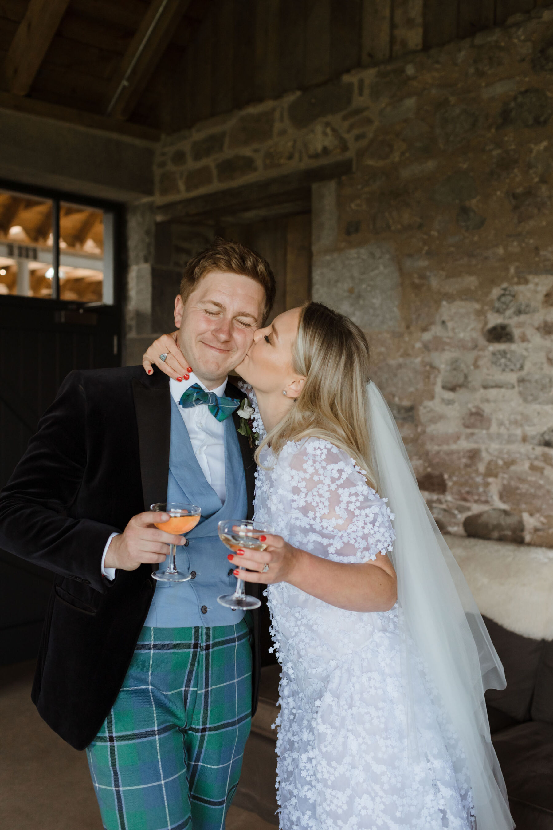 Groom in tartan trousers & bride in Cecilie Bahnsen wedding dress. Caro Weiss Photography.