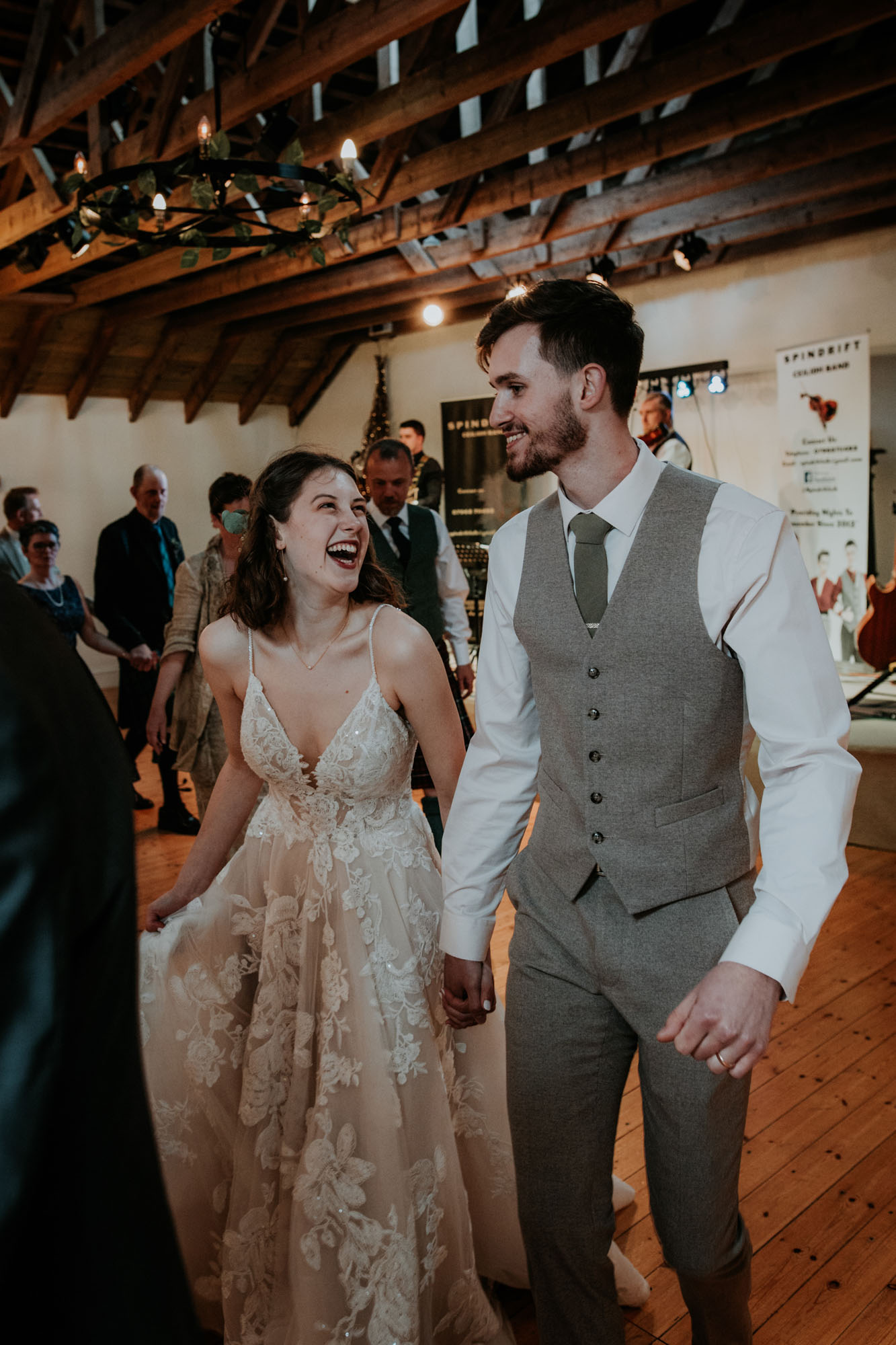 Bride and groom ceilidh dancing