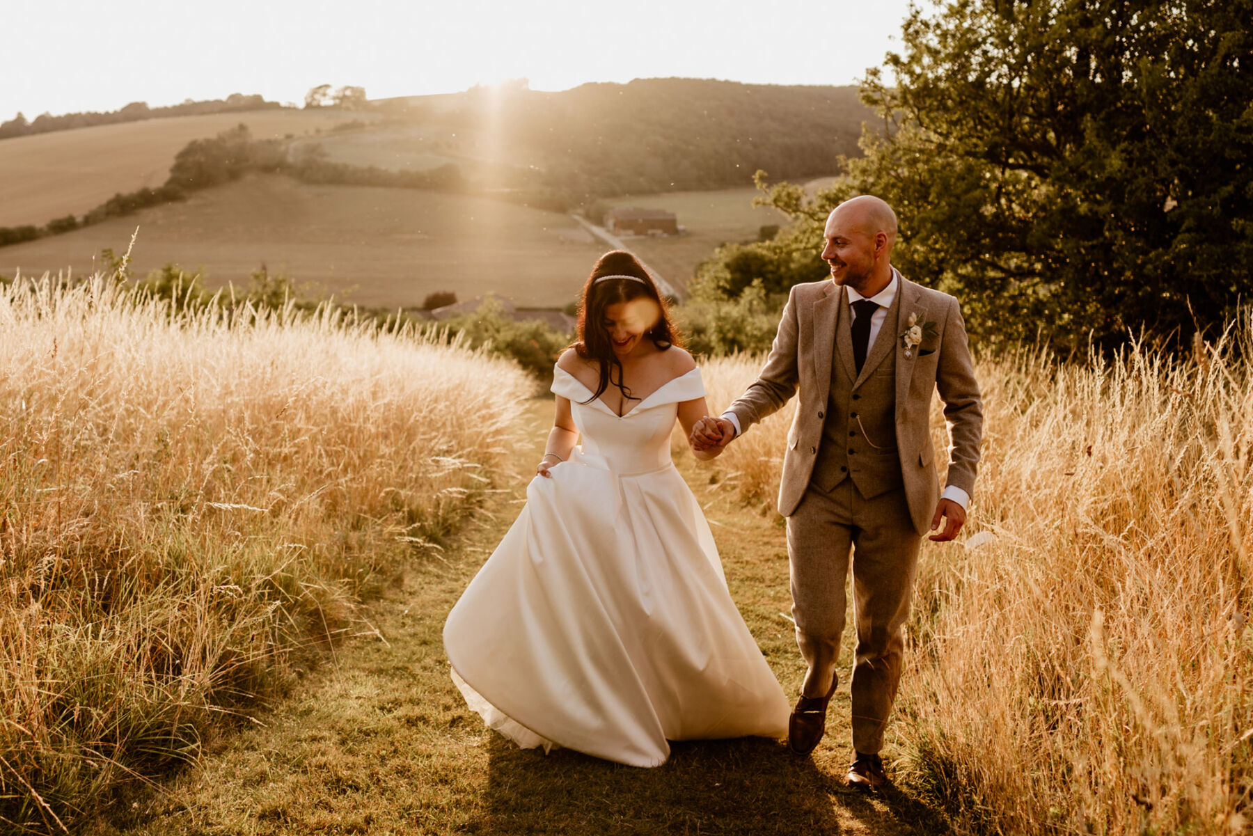 Miss Bush bride wearing Suzanne Neville wedding dress at golden hour.