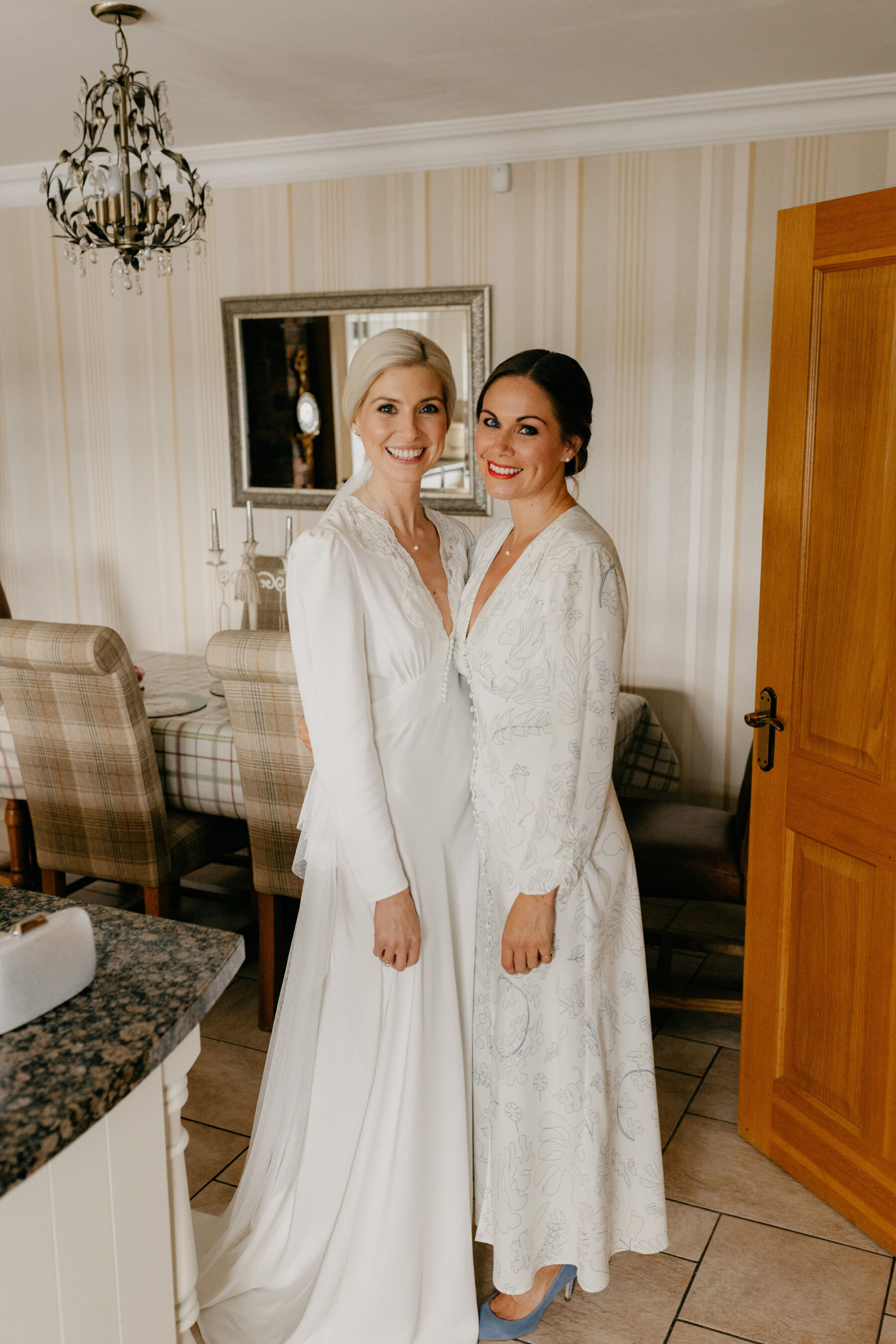 Bride wearing a Rixo wedding dress and bridesmaids wearing a white Rixo dress