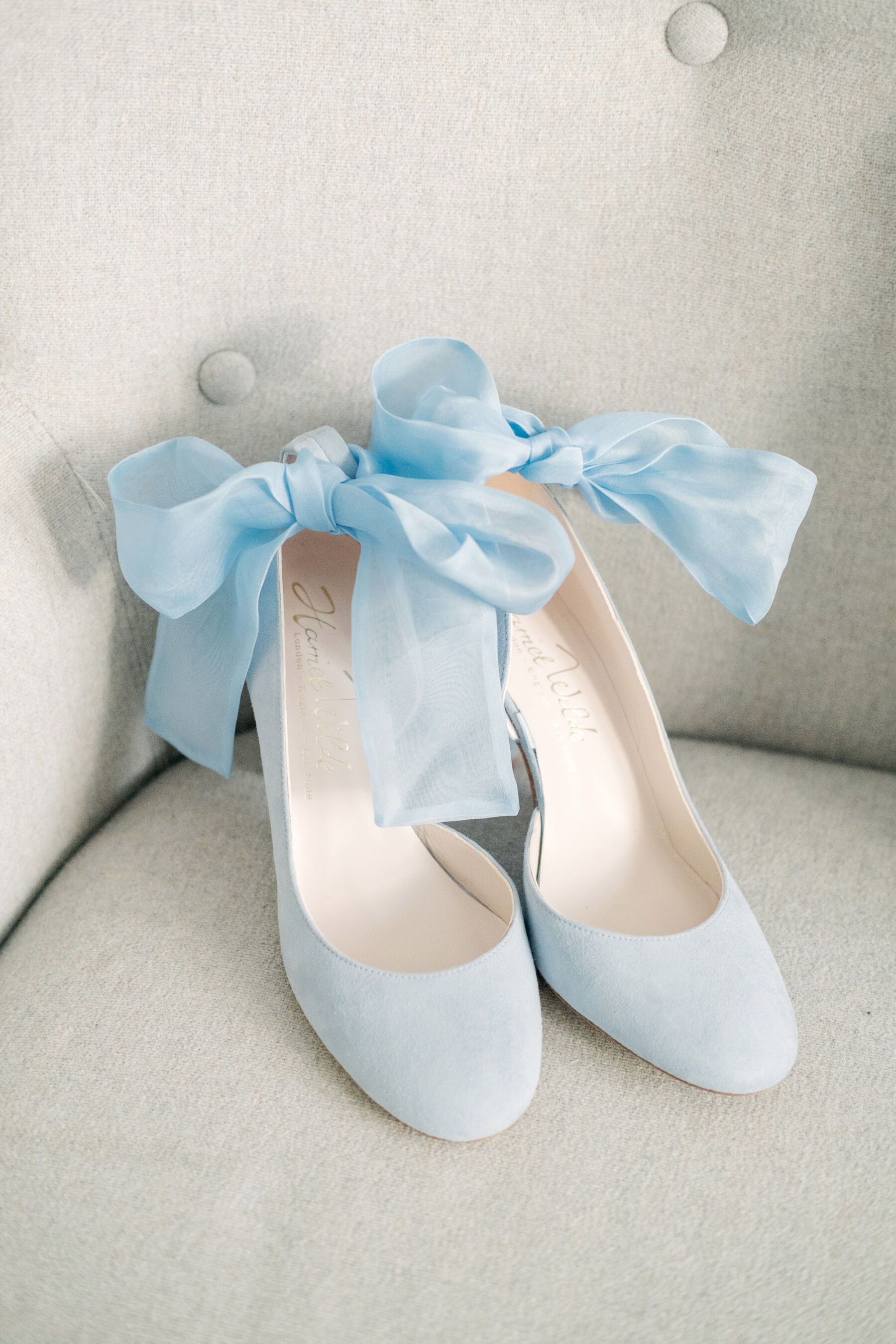 Pale blue velvet wedding shoes with ankle ribbon ties by Harriet Wilde.
