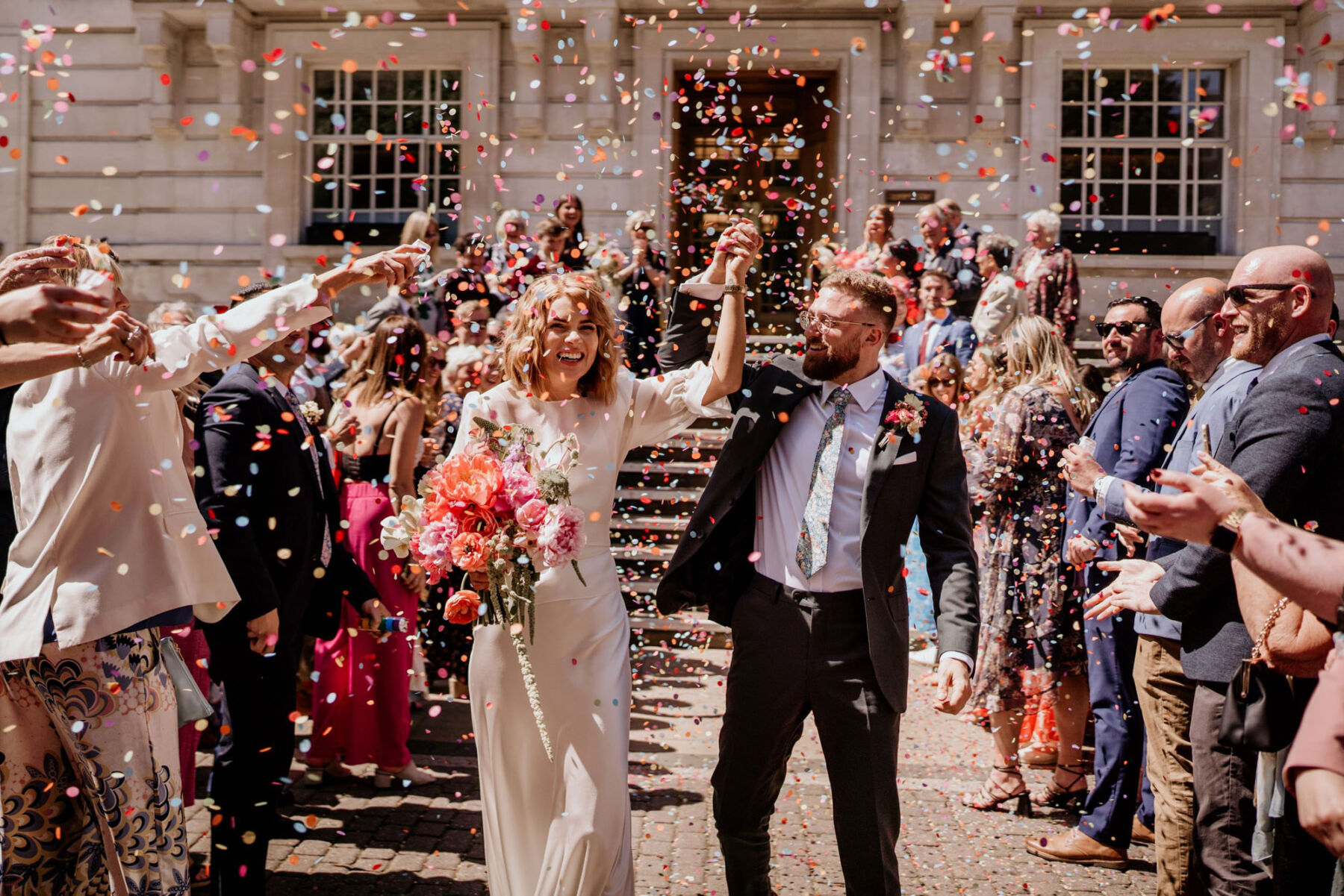 Confetti at Hackney Town Hall wedding. Bride wears The Own Studio.