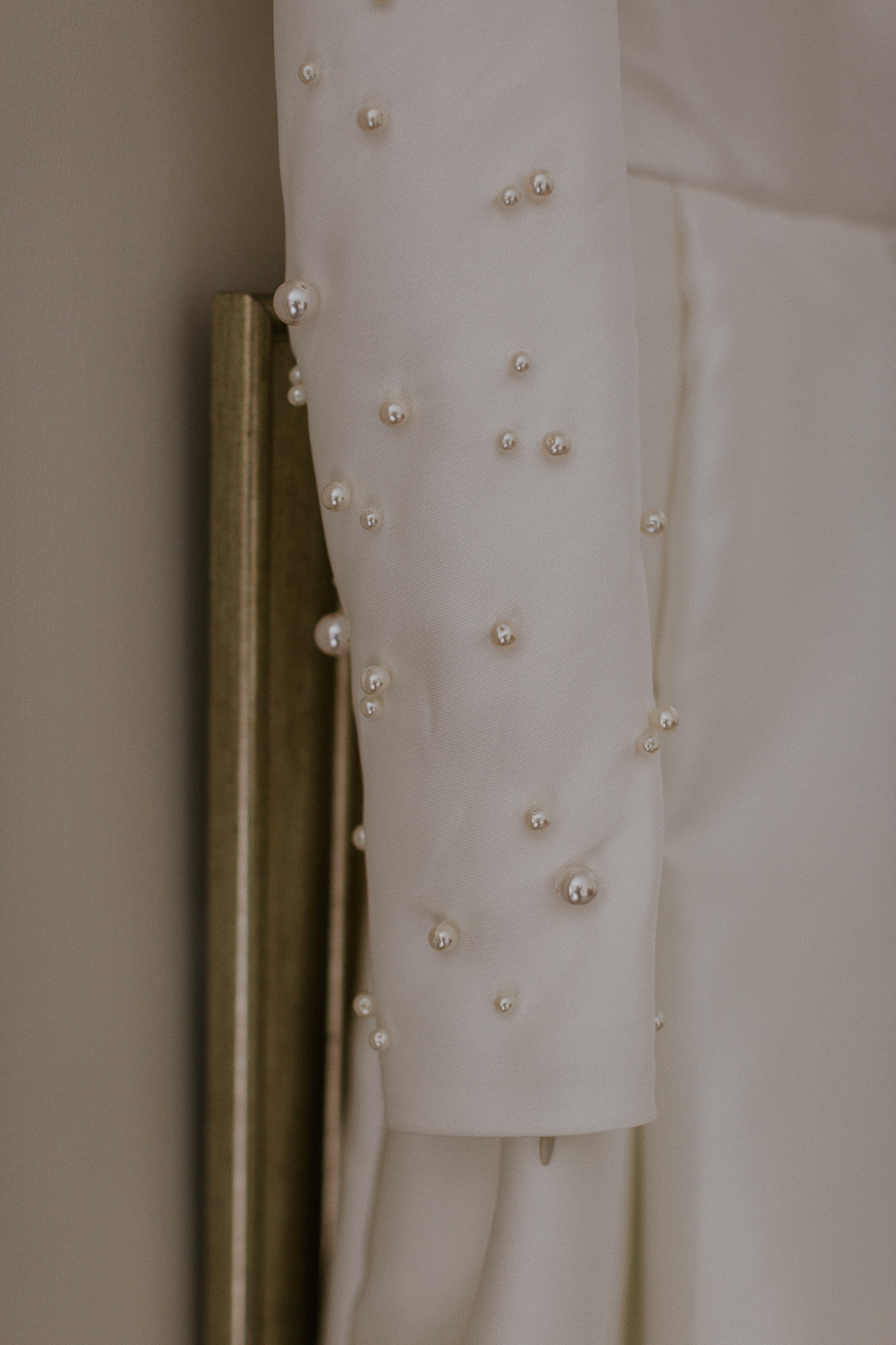 Pearls on wedding dress sleeve