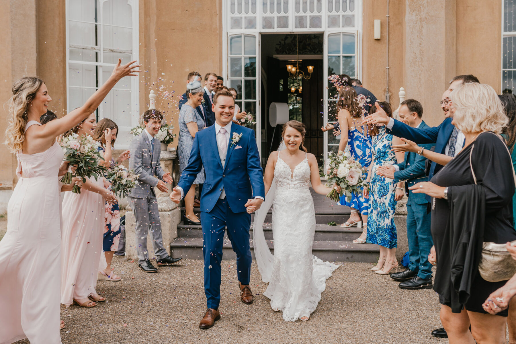 Confetti thrown outside Nonsuch Manor. Shelby Ellis Photography.