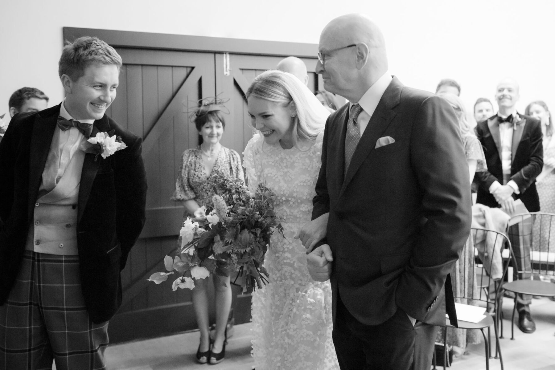 Cecilie Bahnsen bride arriving at ceremony with her father. Caro Weiss Photography.