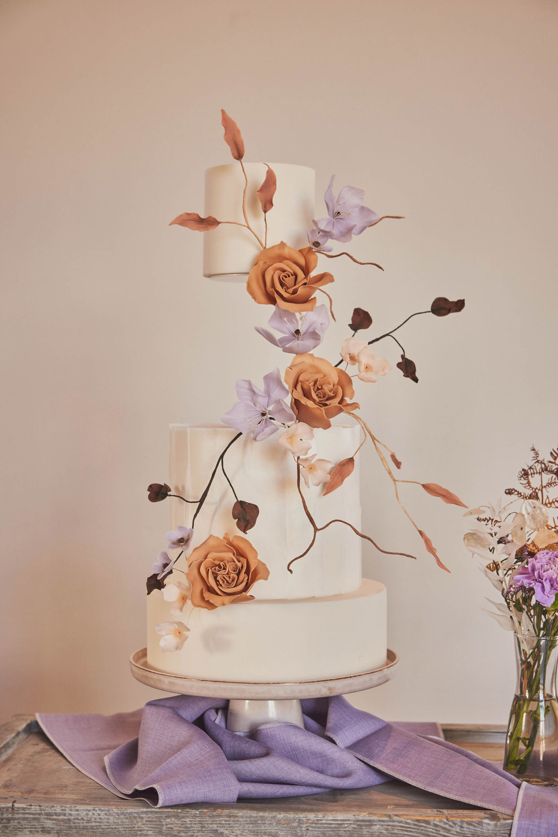Modern wedding cake with floating tier at Brickhouse Vineyard - Devon wedding venue.