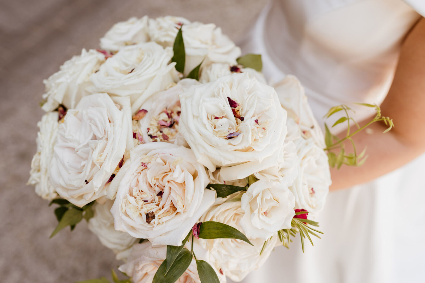 Bouquet of white roses by Mad Lilies Wedding Florist.