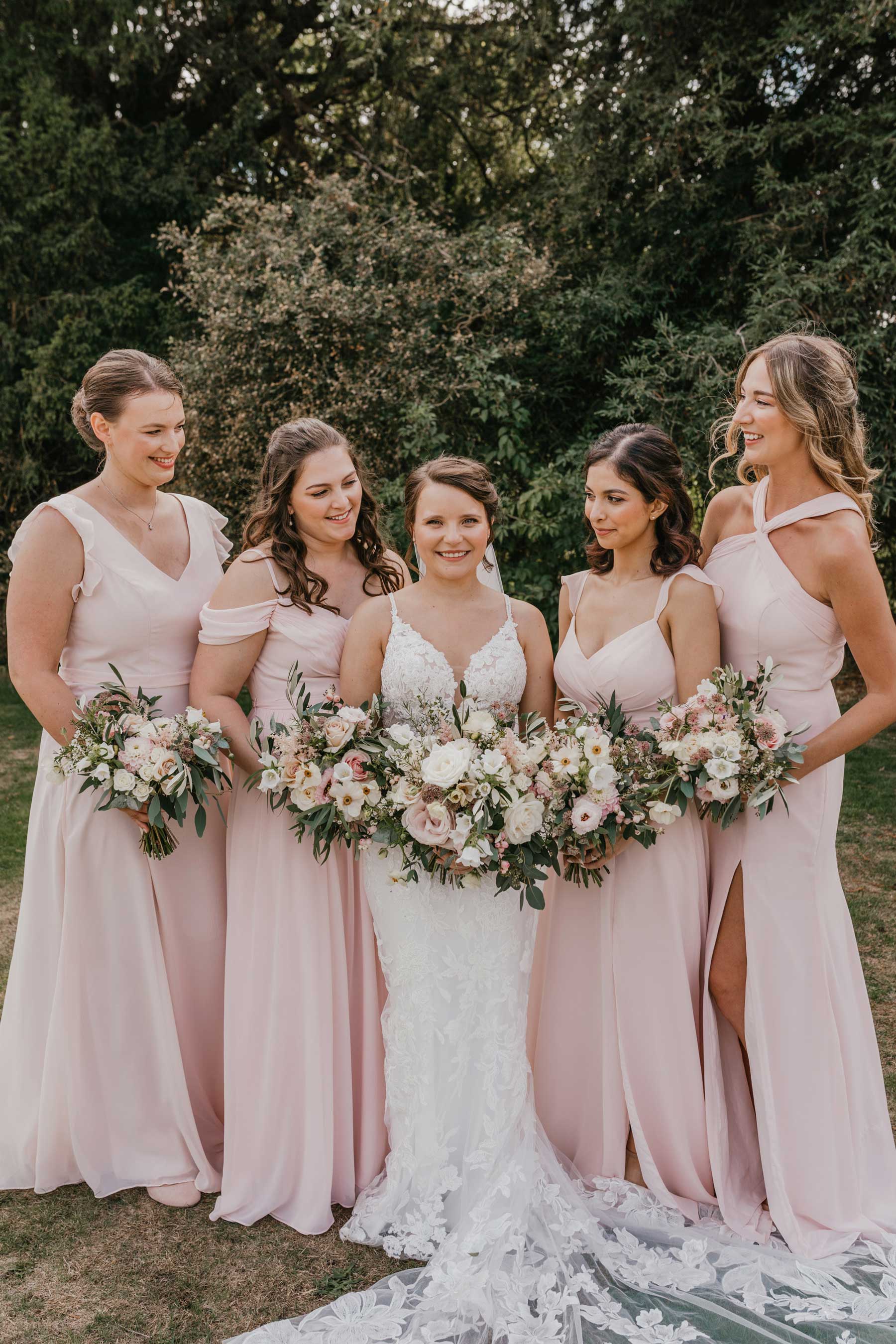 Bridesmaids in pale blush pink dresses. Shelby Ellis Photographyl