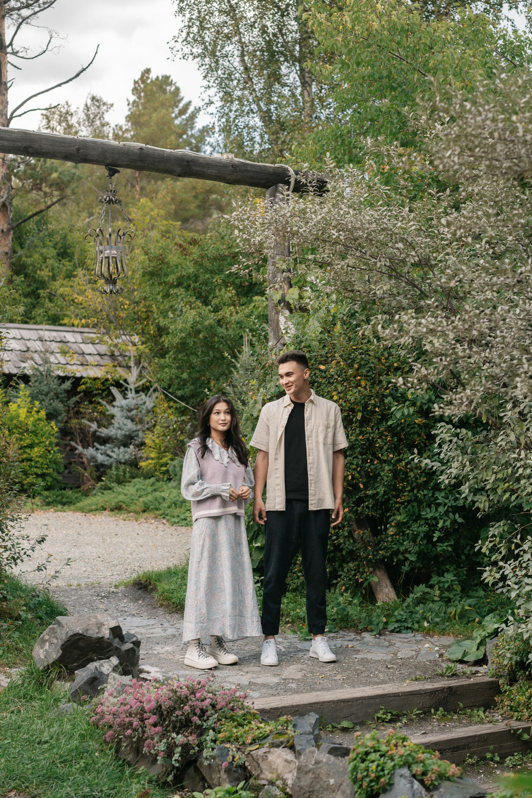 Mixed race couple standing in a garden: Patchwork alternative wedding gift ideas.