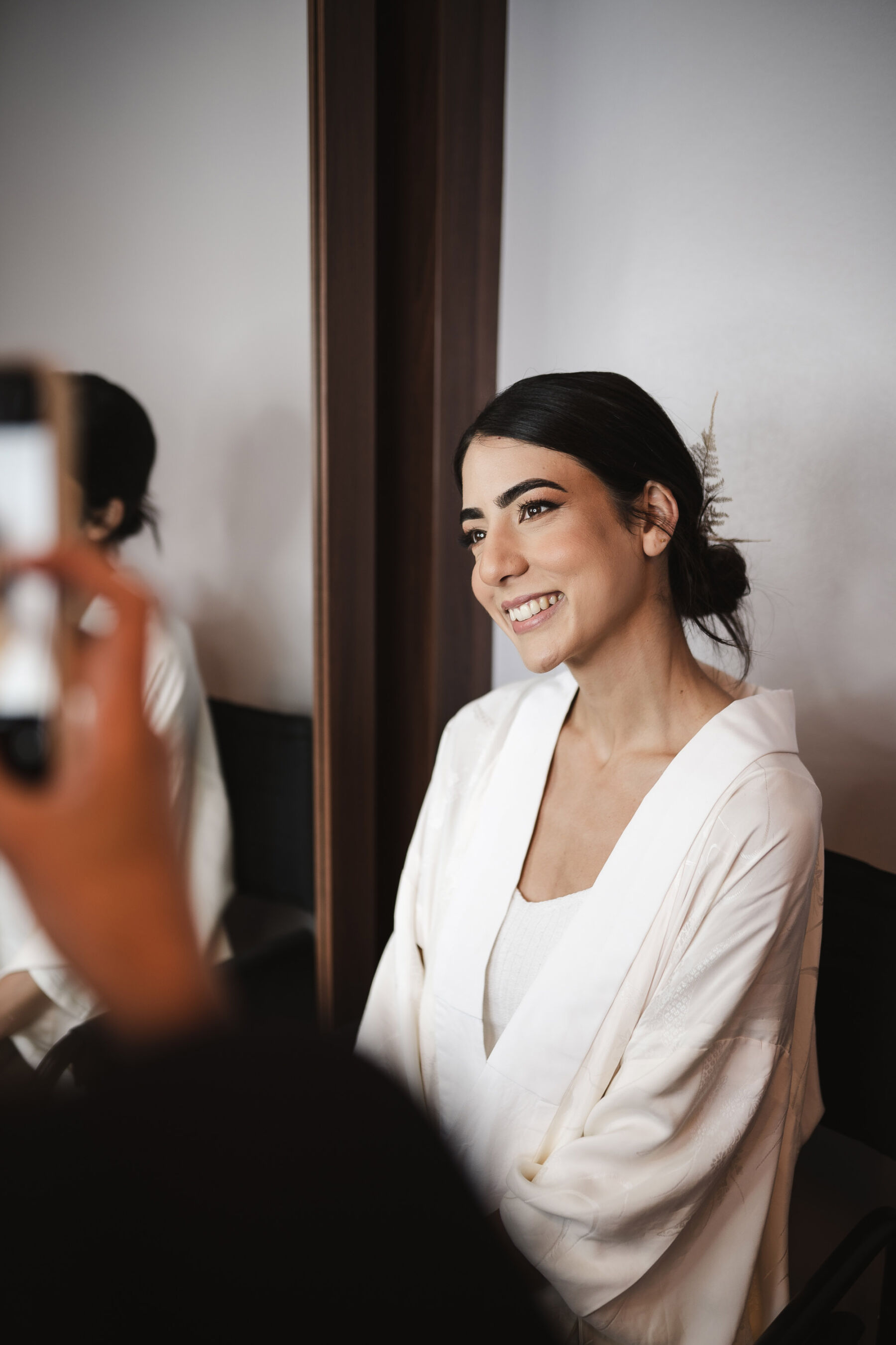 Dark haired bride with simple elegant wedding makeup. By Karolina Photography.