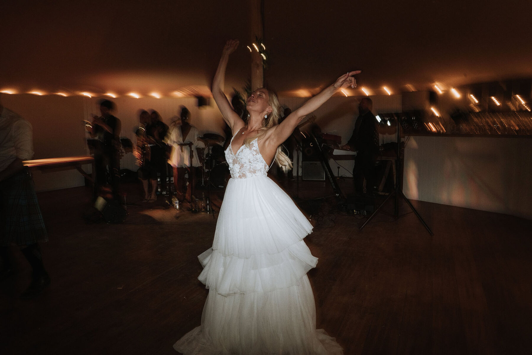 Kindling Bridal wedding dress - bride letting go on the dancefloor