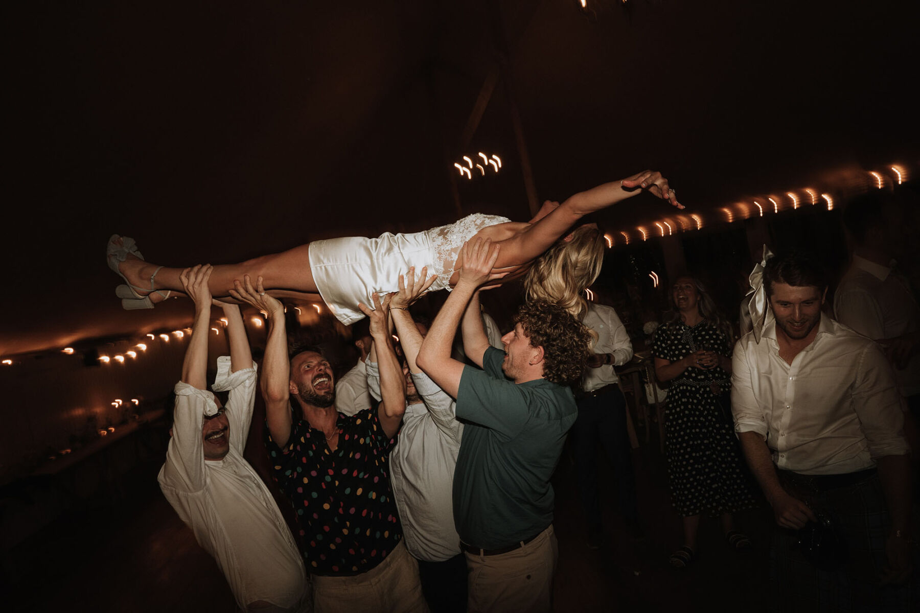 Bride lifted off the dance floor.