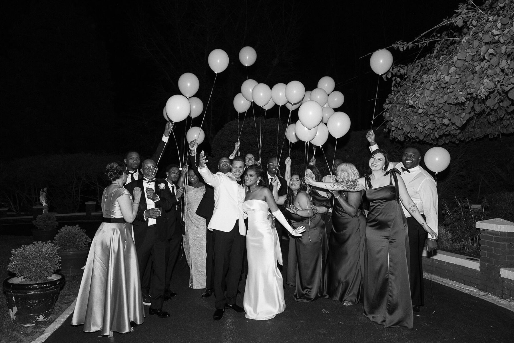 Bride and groom with lots of balloons