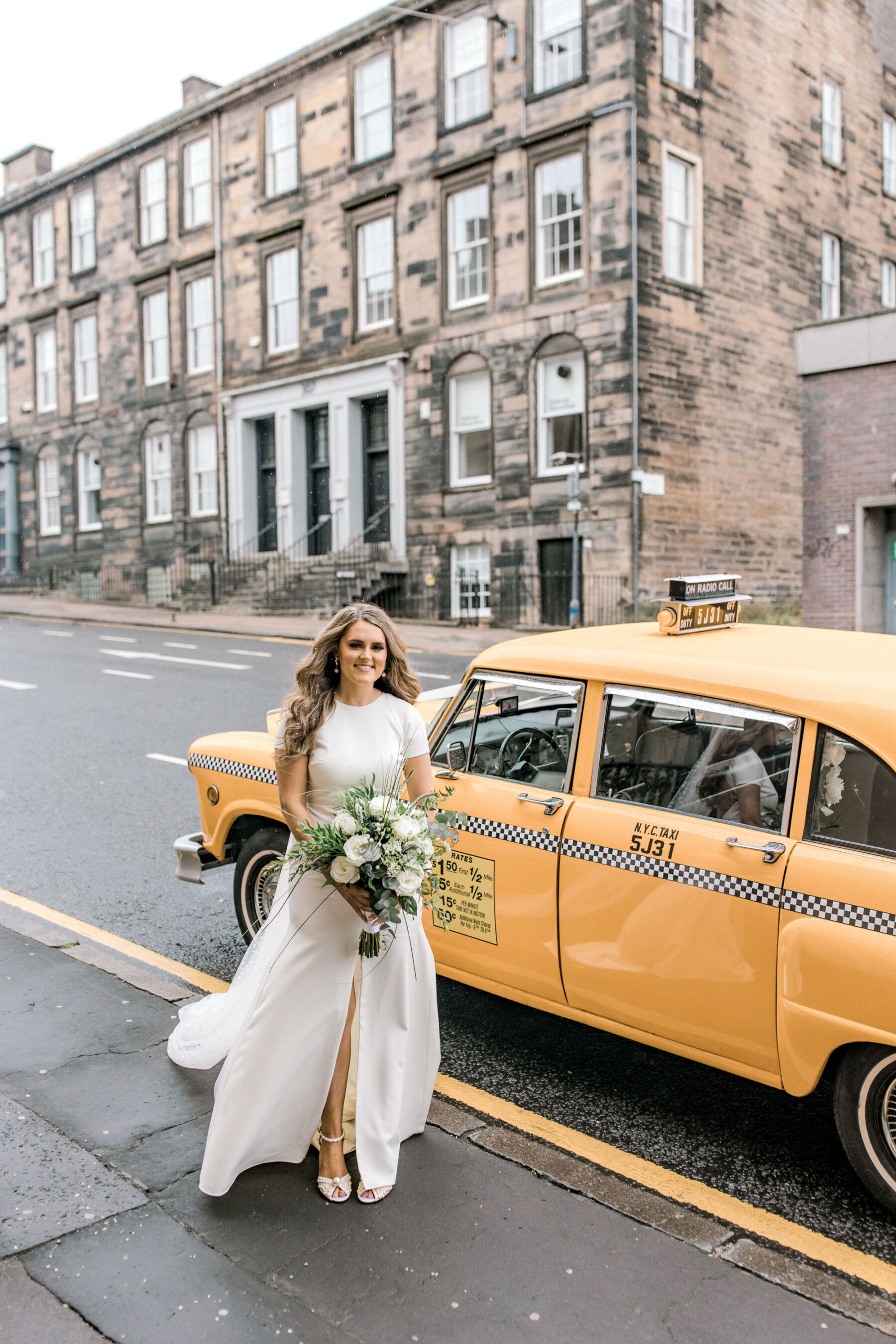 Bride and yellow New York taxi cab