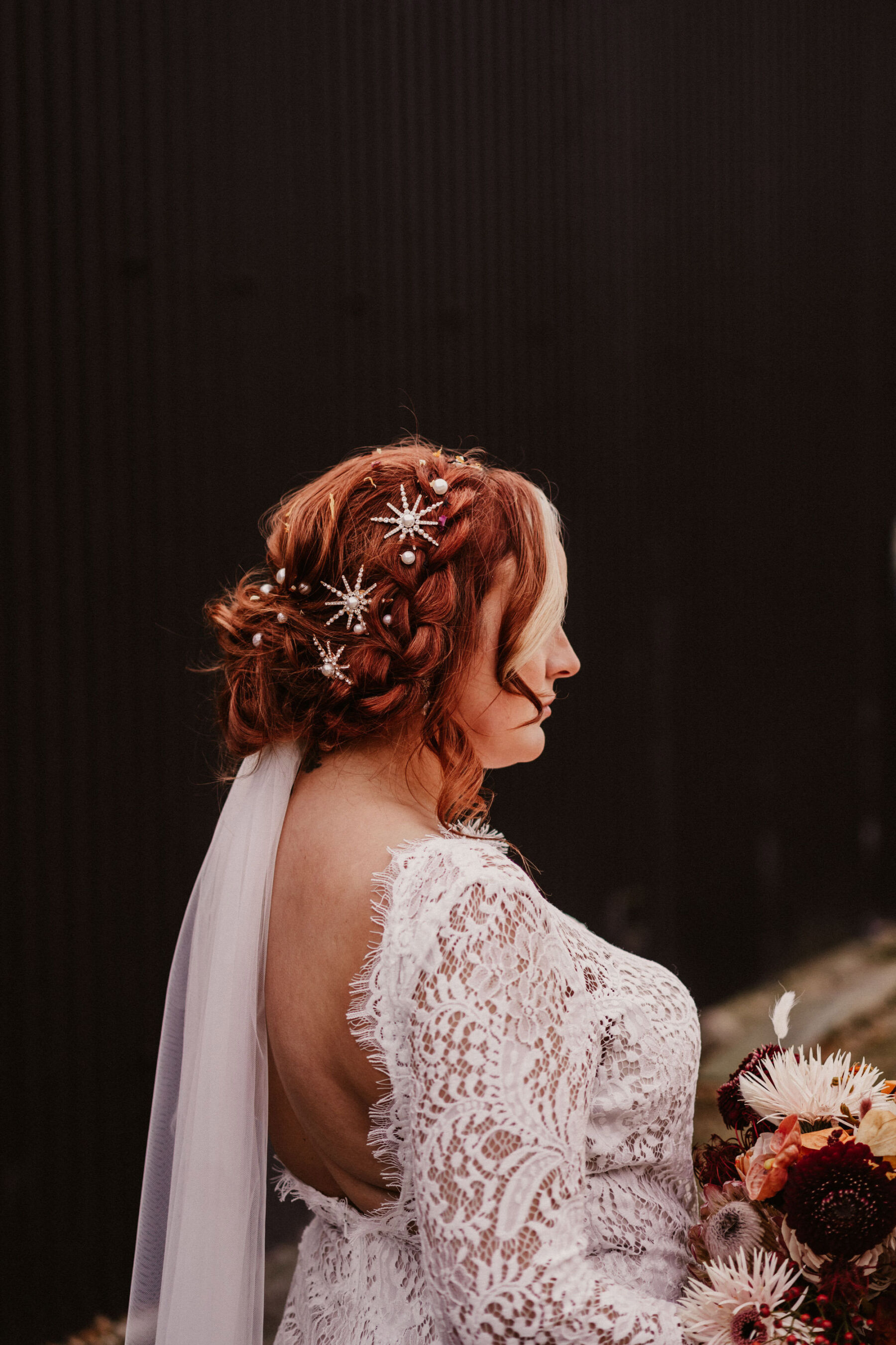 Bride with celestial, star hair clips and pearls in her hair.