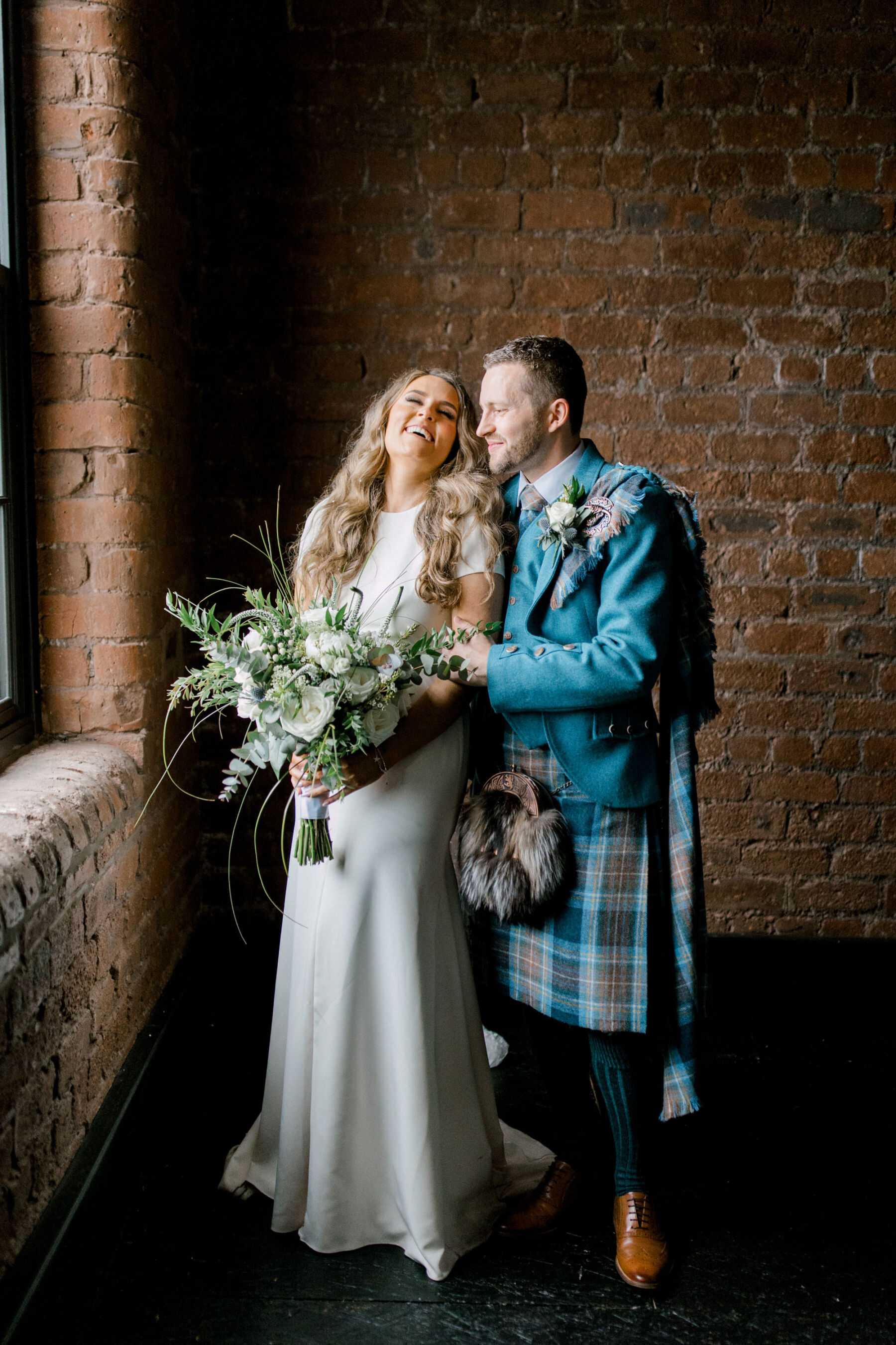Bride in Sarah Seven and groom in a kilt