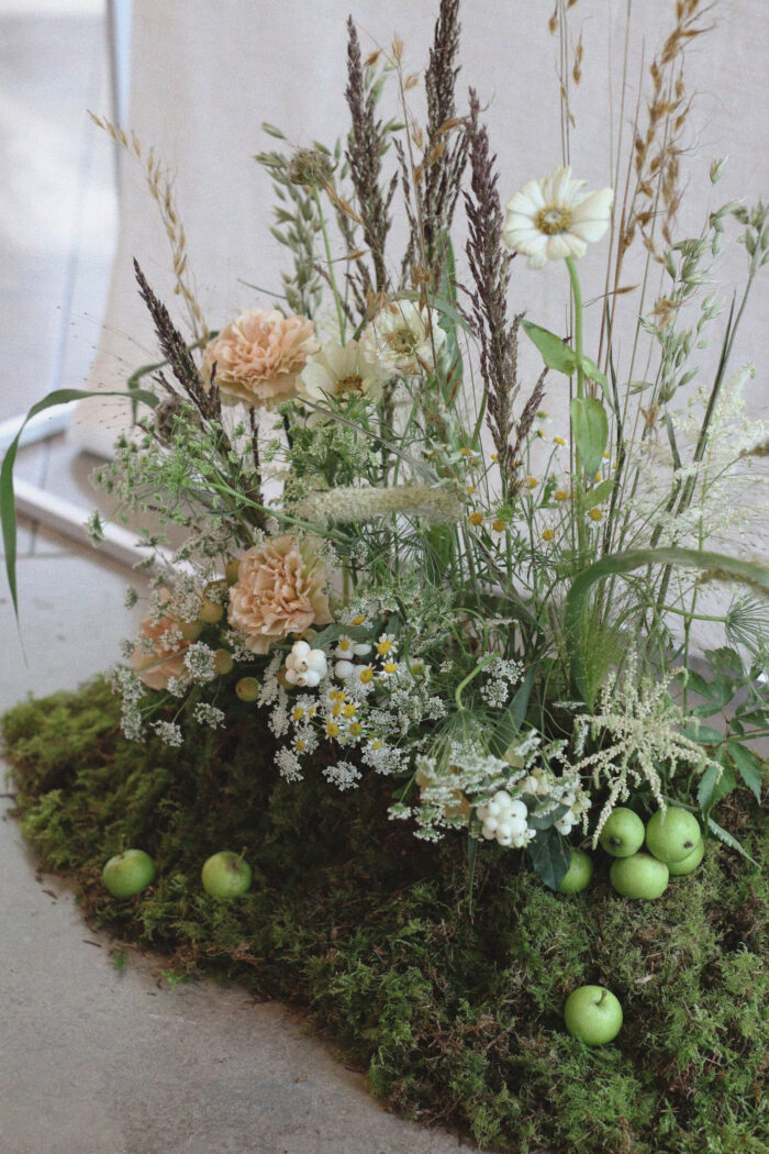 Meadow wedding flowers styled with apples and moss, by Honour Farm Folk