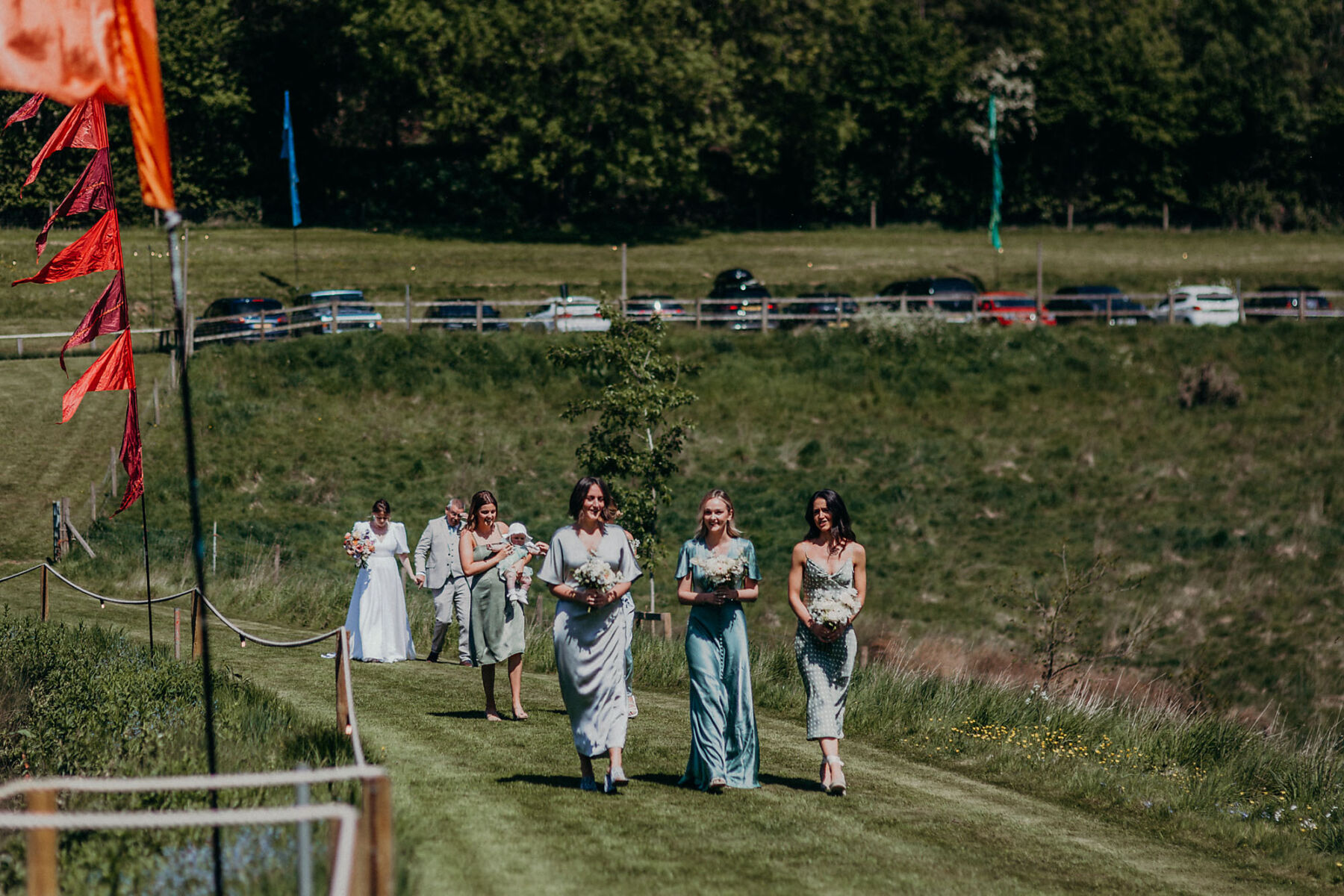 Bridesmaids in sage green wedding dresses