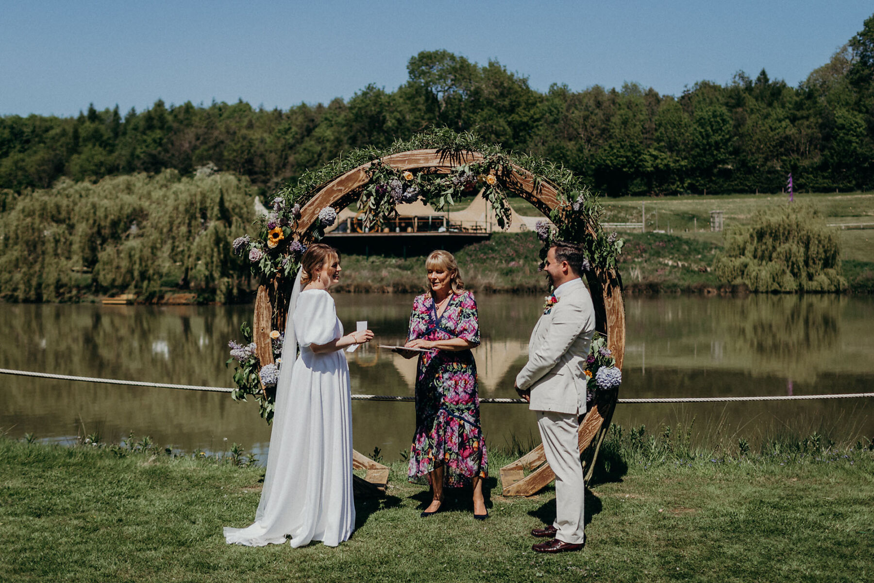 Wooden wedding moon with decorative flowers and foliage.