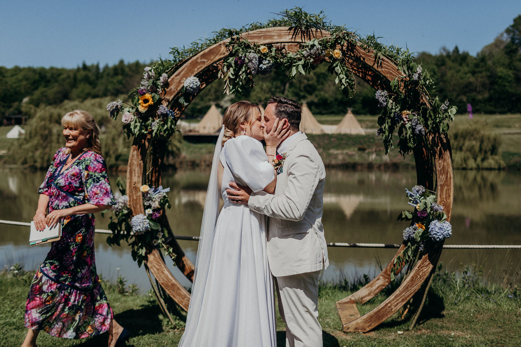 Wooden wedding moon with decorative flowers and foliage.