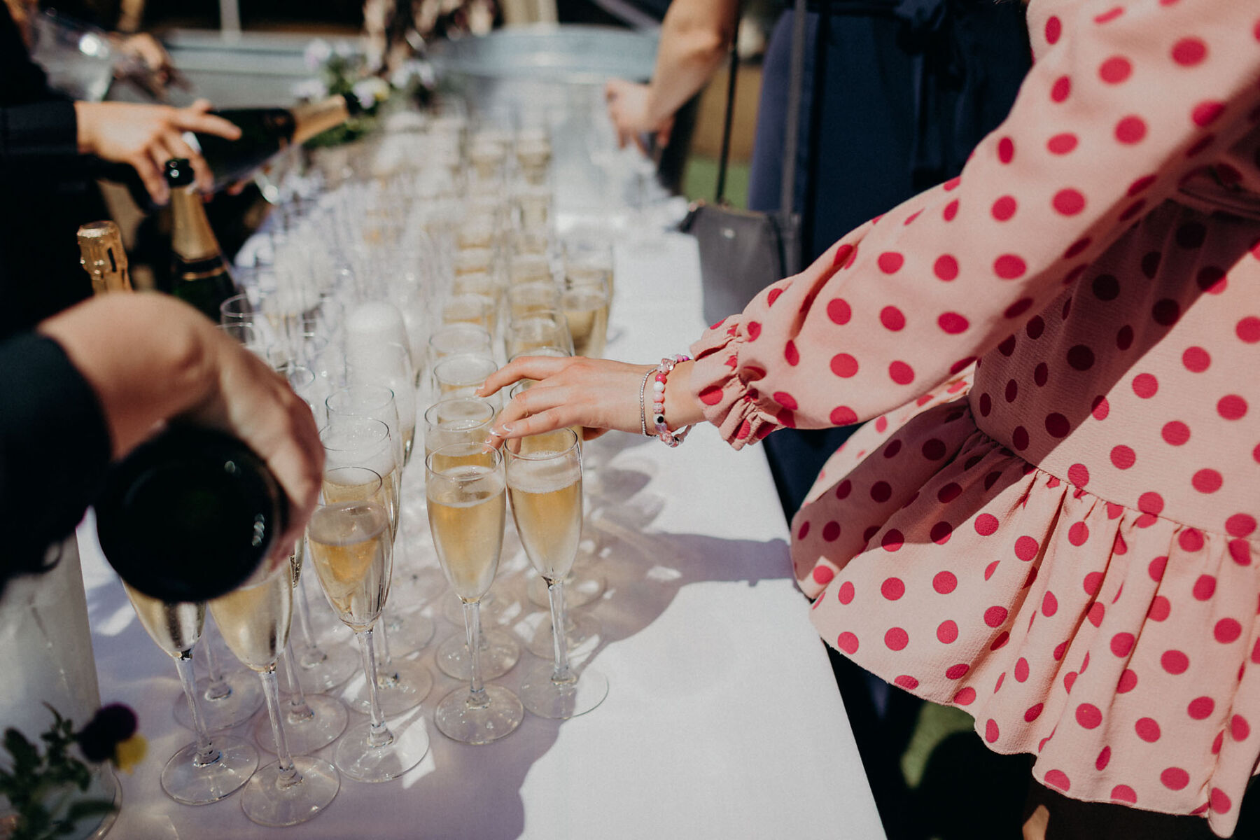 Guests helping themselves to glasses of wedding champagne