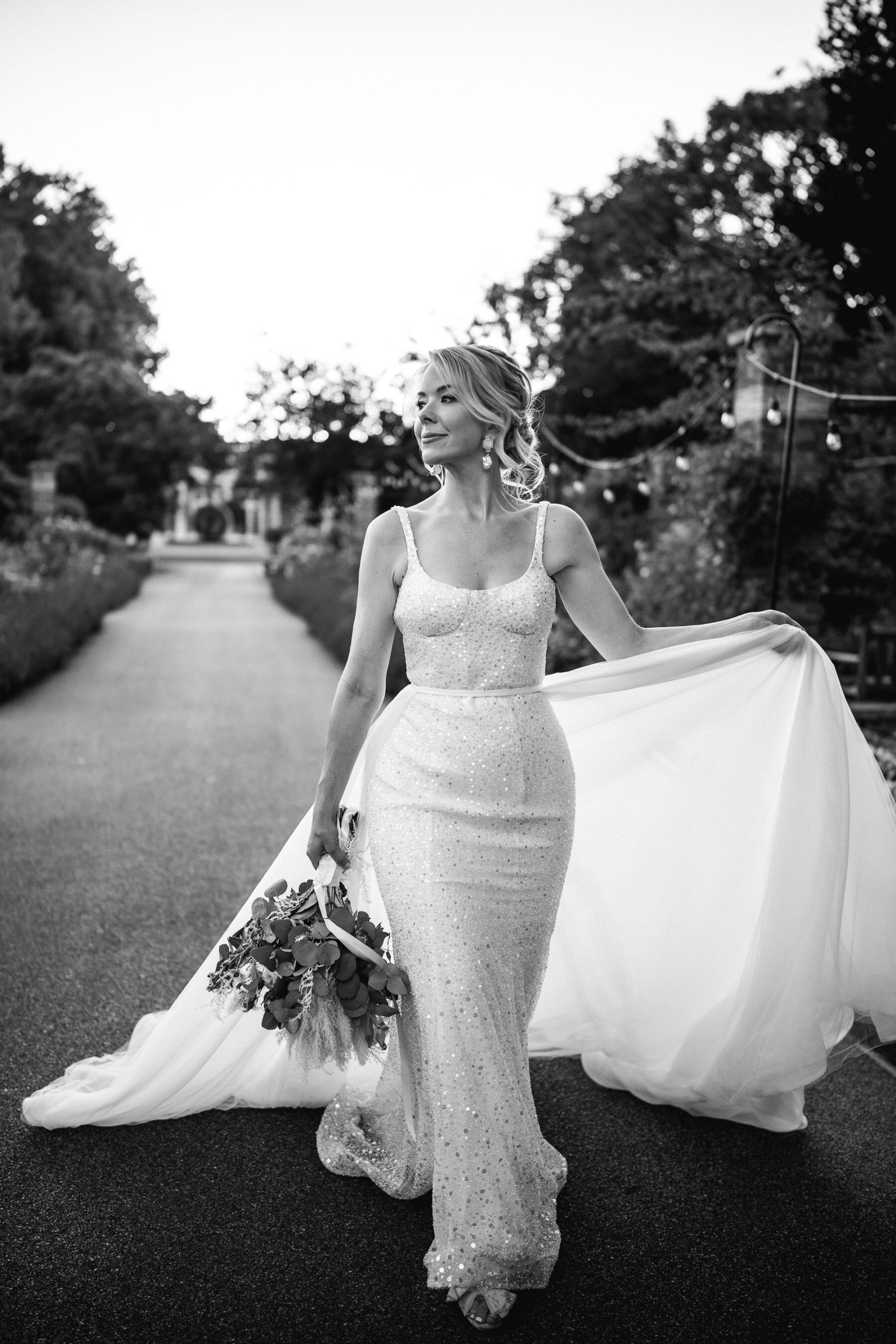 Khya Studios sequin wedding dress. Skinny fit skirt and long train wedding dress.