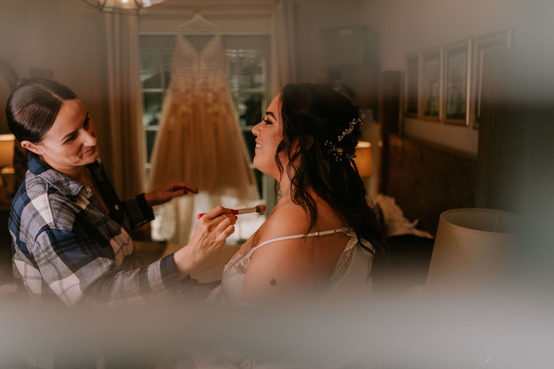 Bridal makeup artist applying lipstick