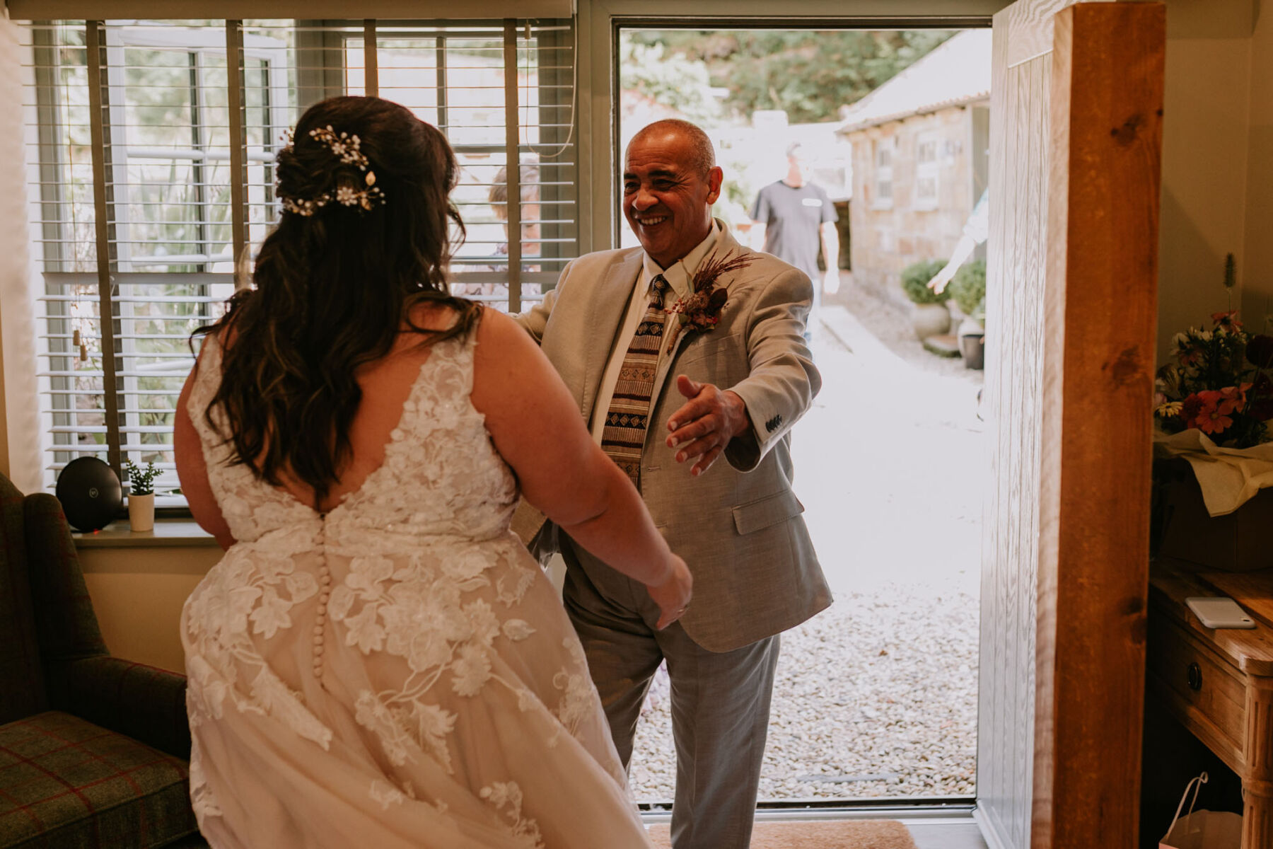 Father of the bride seeing his daughter on her wedding day for the first time