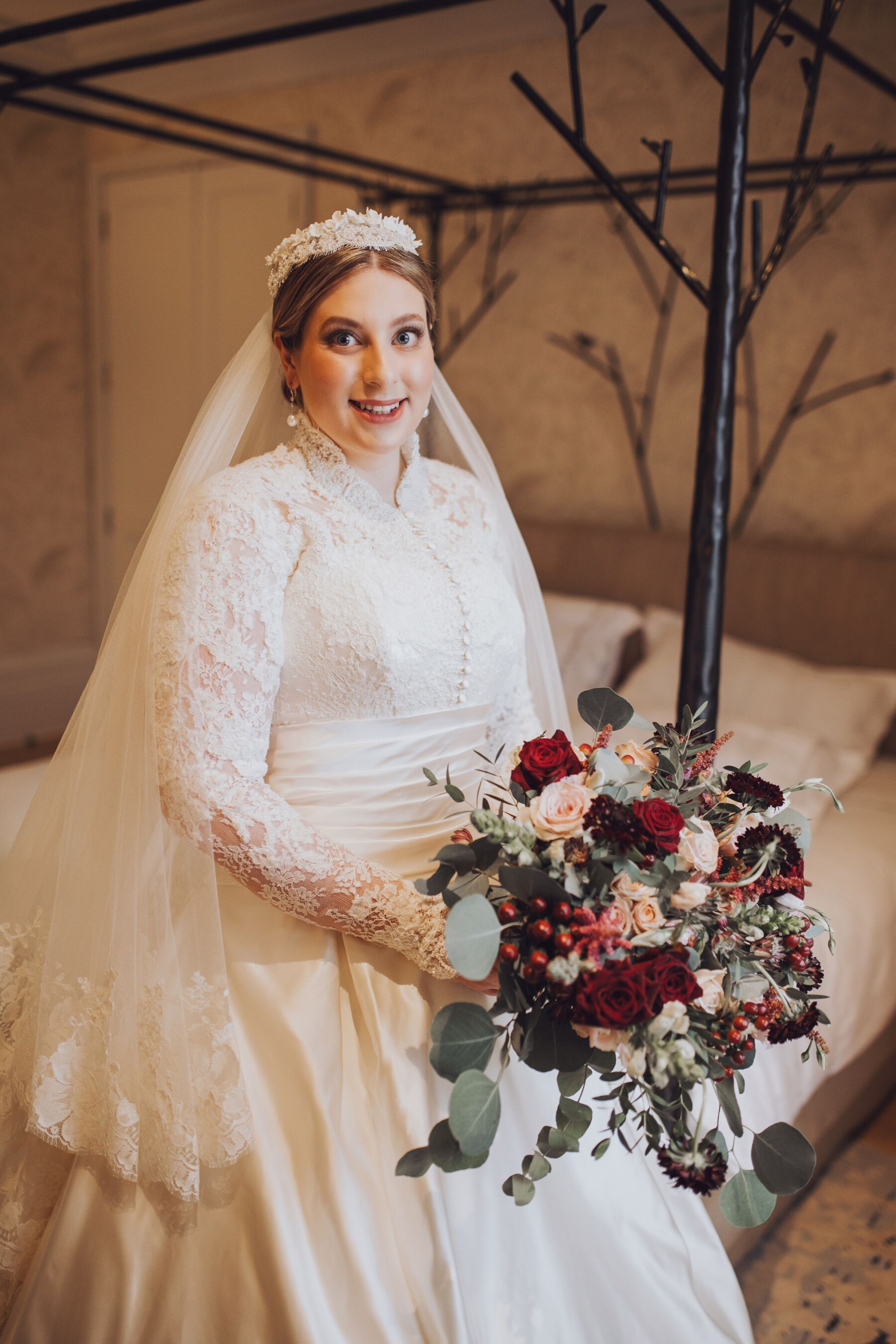Fuller figure curvy bride wearing a long sleeved wedding dress by Sally Bean Couture
